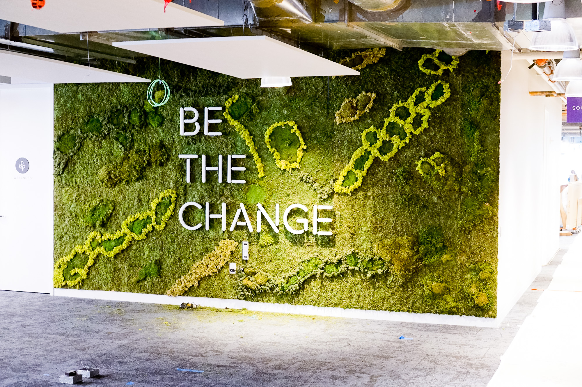 Neon-style, motivational “be the change” sign on a large moss / living wall for Scale, a San Francisco based company delivering high quality training data for AI applications such as self-driving cars, mapping, AR/VR, robotics, and more. Neon-style, motivational