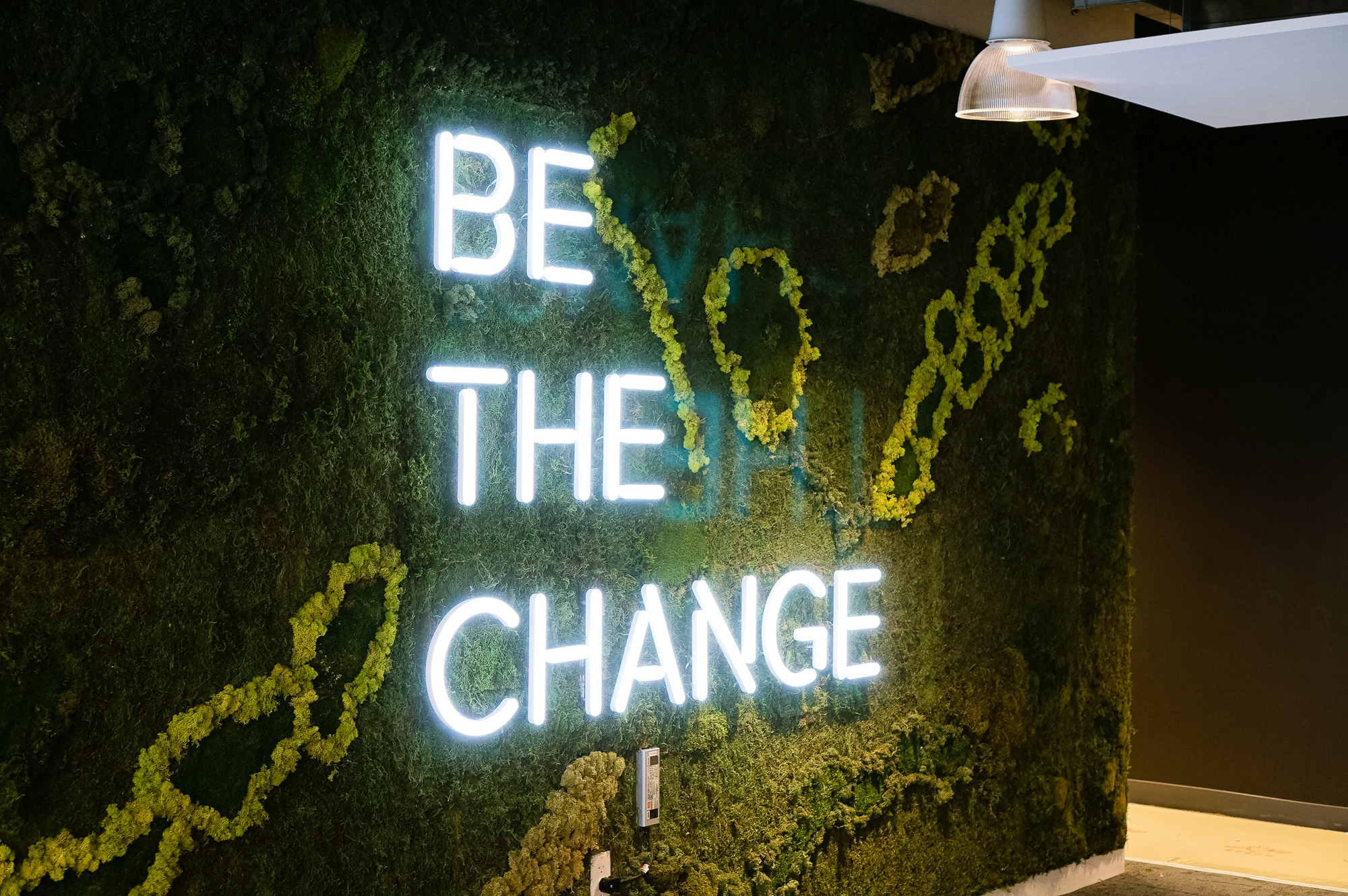 Neon-style, motivational “be the change” sign on a large moss / living wall for Scale, a San Francisco based company delivering high quality training data for AI applications such as self-driving cars, mapping, AR/VR, robotics, and more. Neon-style, motivational