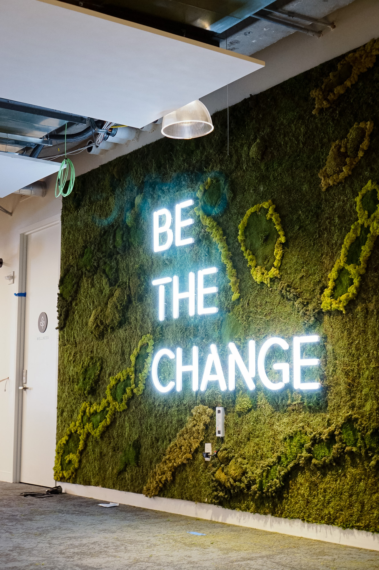 Neon-style, motivational “be the change” sign on a large moss / living wall for Scale, a San Francisco based company delivering high quality training data for AI applications such as self-driving cars, mapping, AR/VR, robotics, and more. Neon-style, motivational