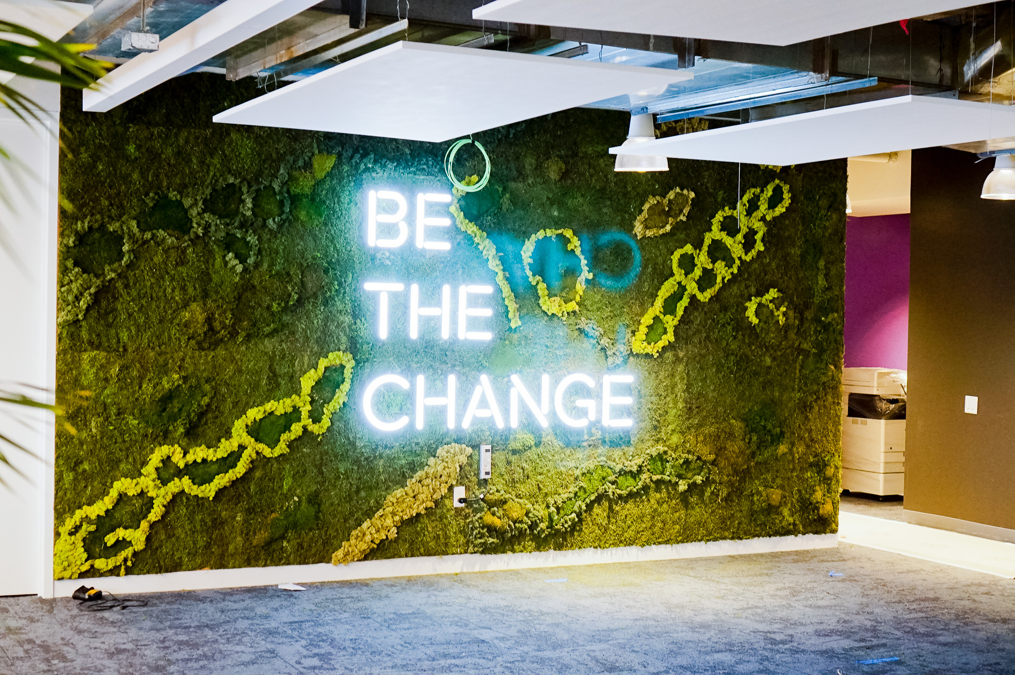 Neon-style, motivational “be the change” sign on a large moss / living wall for Scale, a San Francisco based company delivering high quality training data for AI applications such as self-driving cars, mapping, AR/VR, robotics, and more. Neon-style, motivational