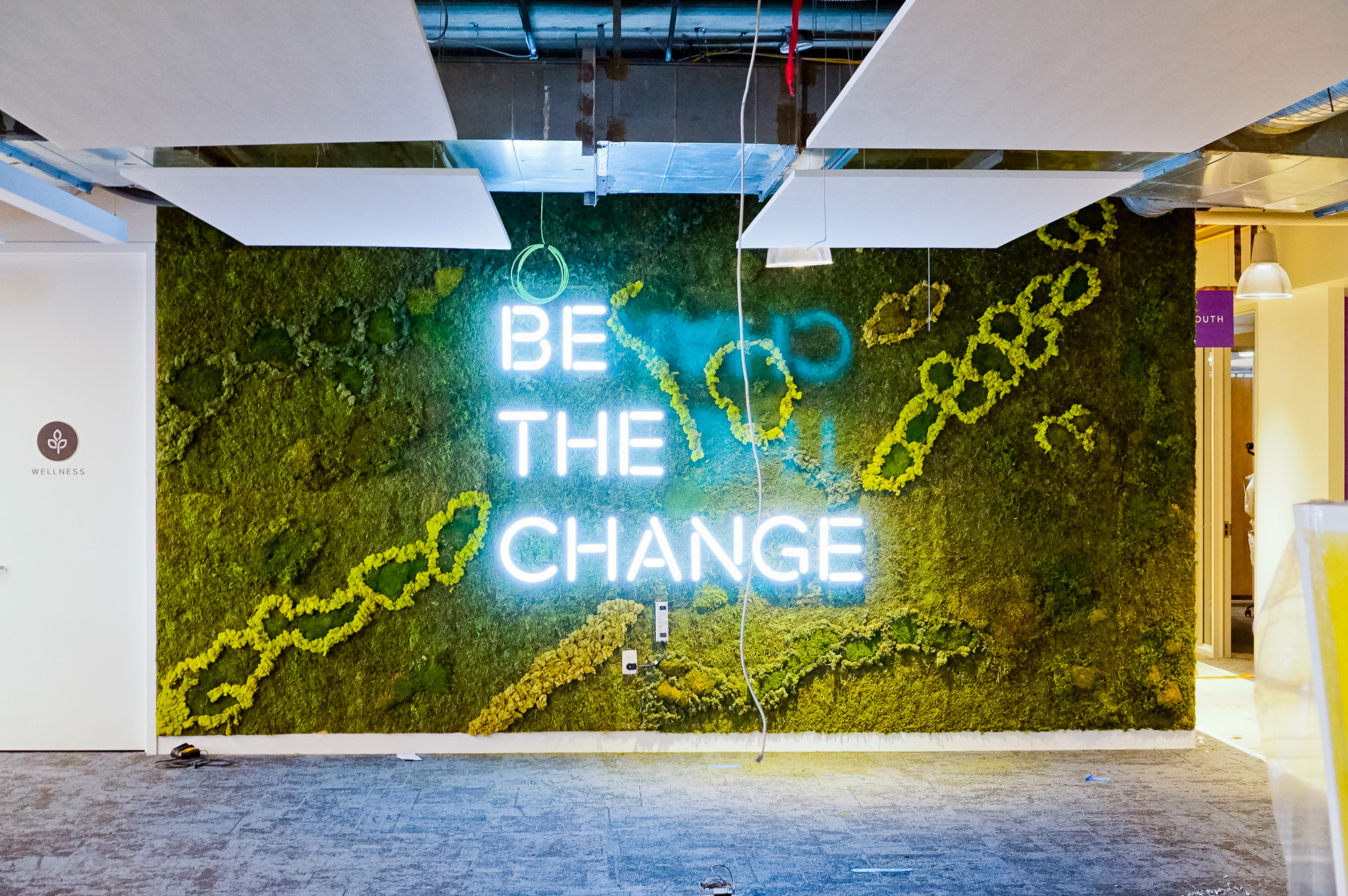 Neon-style, motivational “be the change” sign on a large moss / living wall for Scale, a San Francisco based company delivering high quality training data for AI applications such as self-driving cars, mapping, AR/VR, robotics, and more. Neon-style, motivational