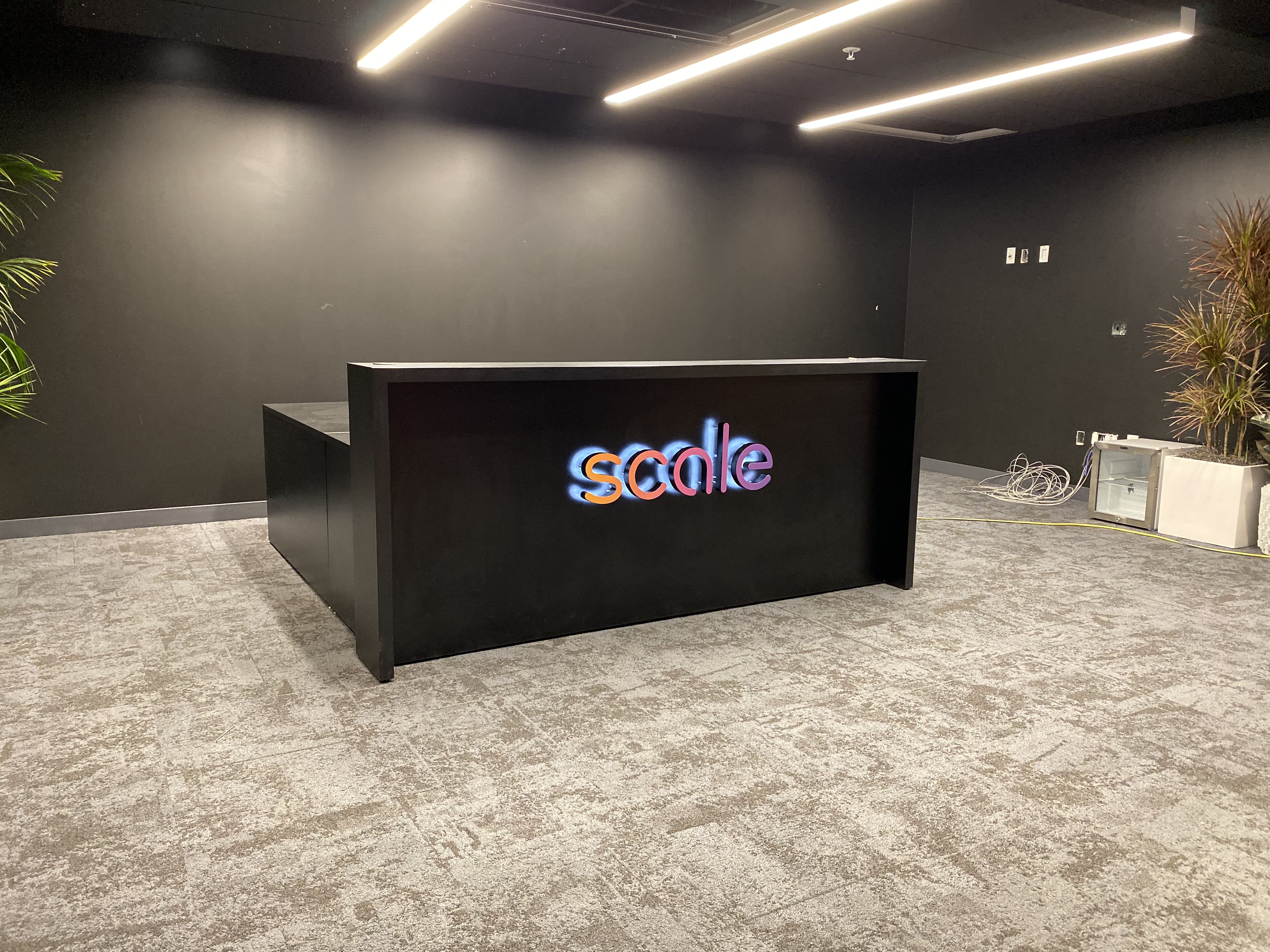 Gradient, halo-lit / back-lit illuminated sign on reception desk in the lobby of Scale, a San Francisco based company delivering high quality training data for AI applications such as self-driving cars, mapping, AR/VR, robotics, and more. Gradient, halo-lit / back-lit illuminated sign on reception desk in the lobby of Scale, a San Francisco based company delivering high quality training data for AI applications such as self-driving cars, mapping, AR/VR, robotics, and more.