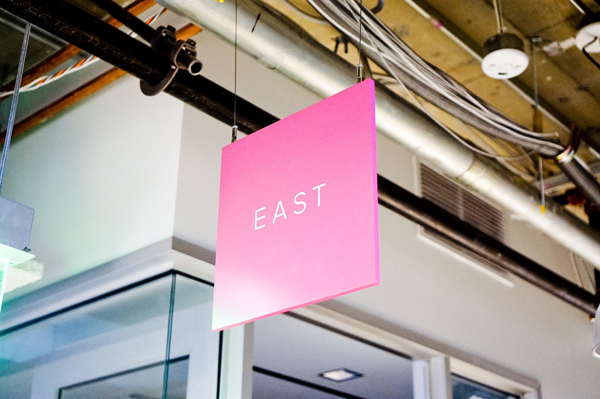 Minimal, multi-colored north, south, east, and west suspended directional signs for Scale, a San Francisco based company delivering high quality training data for AI applications such as self-driving cars, mapping, AR/VR, robotics, and more. Minimal, multi-colored north, south, east, and west suspended directional signs for Scale, a San Francisco based company delivering high quality training data for AI applications such as self-driving cars, mapping, AR/VR, robotics, and more.