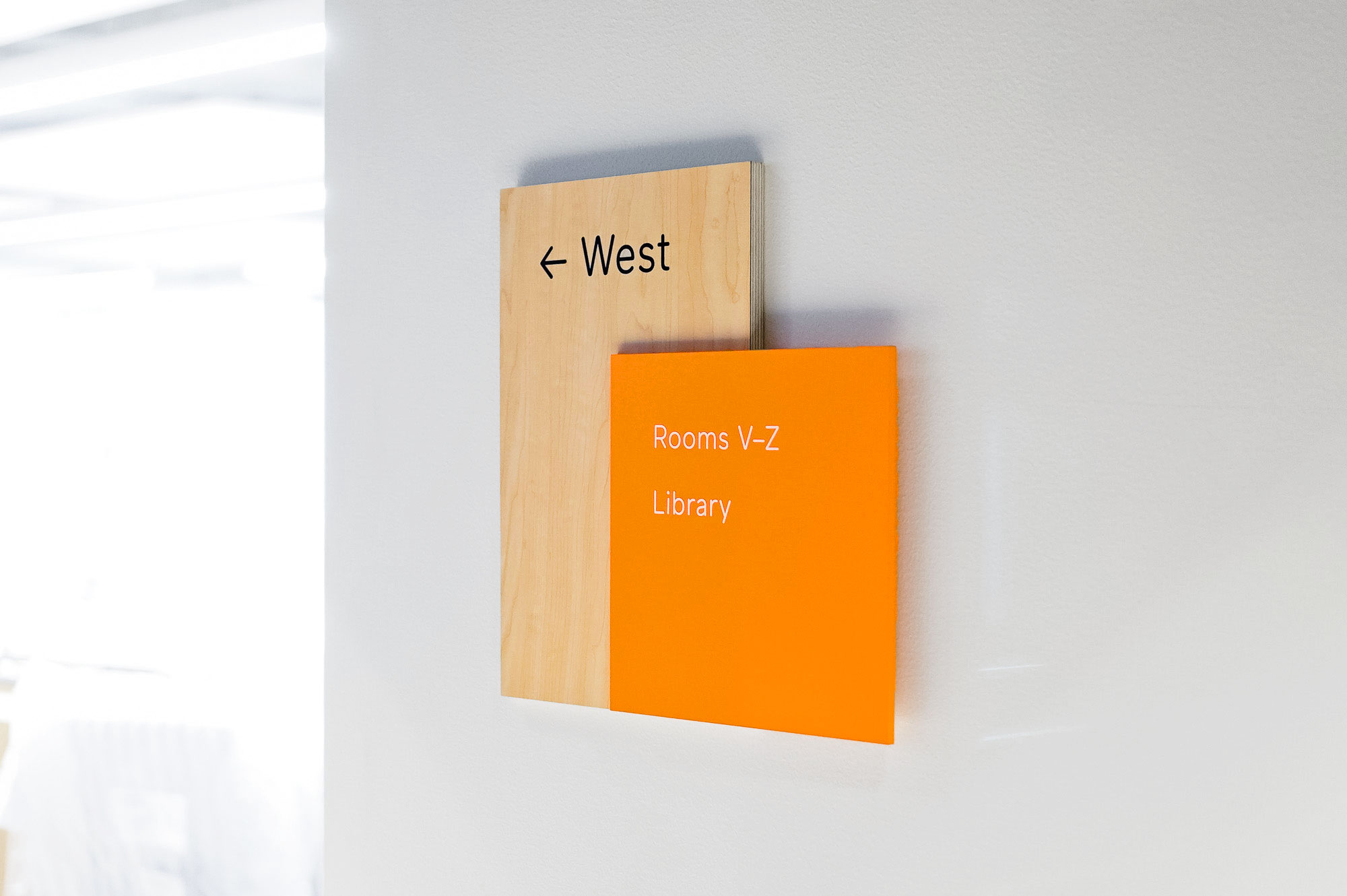 Modern light wood and colored wayfinding wall panels for Scale, a San Francisco based company delivering high quality training data for AI applications such as self-driving cars, mapping, AR/VR, robotics, and more.