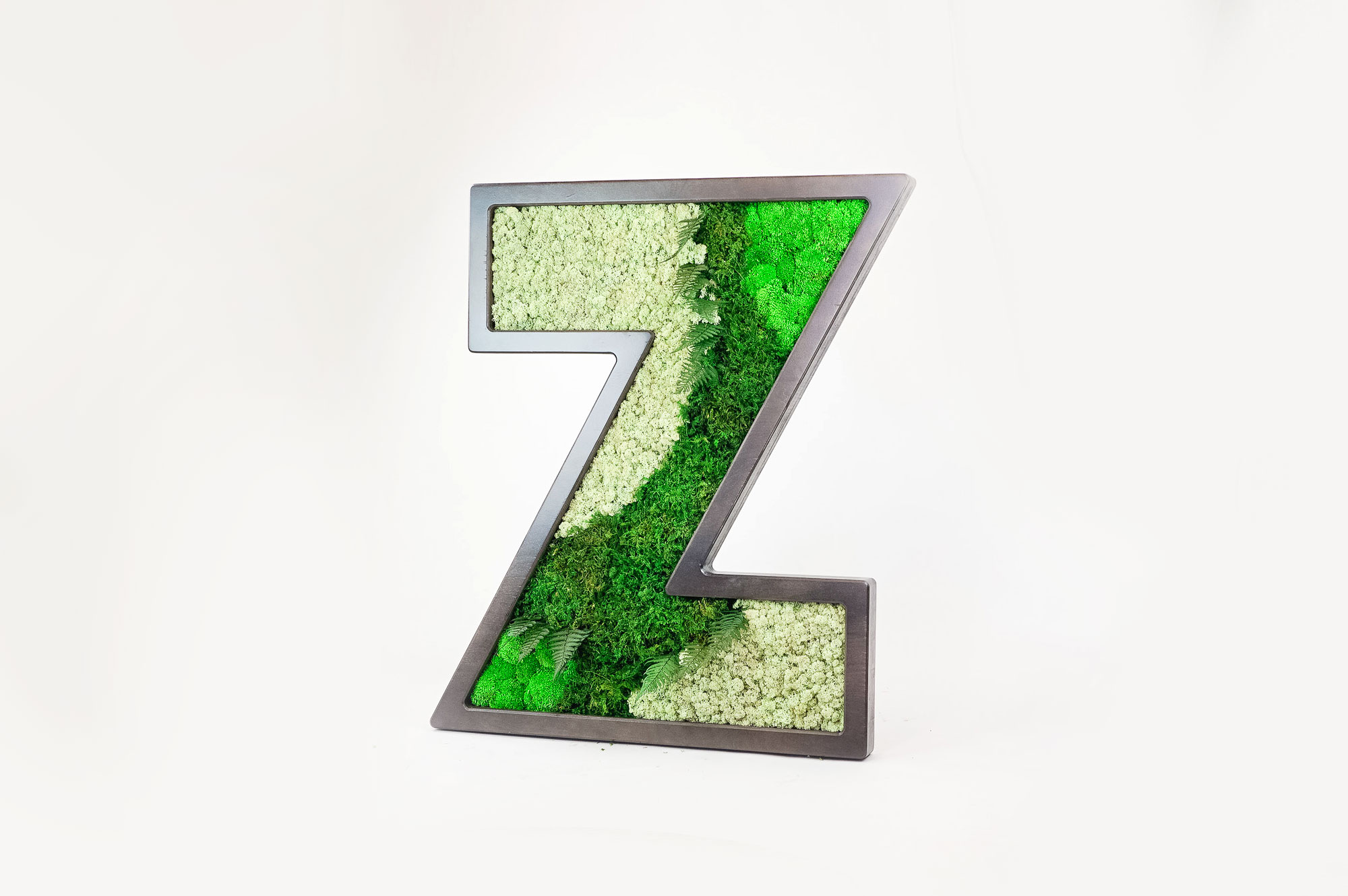 Dark wood letter filled with preserved moss art for Zumper, a full-service rental platform. Dark wood letter filled with preserved moss art for Zumper, a full-service rental platform.