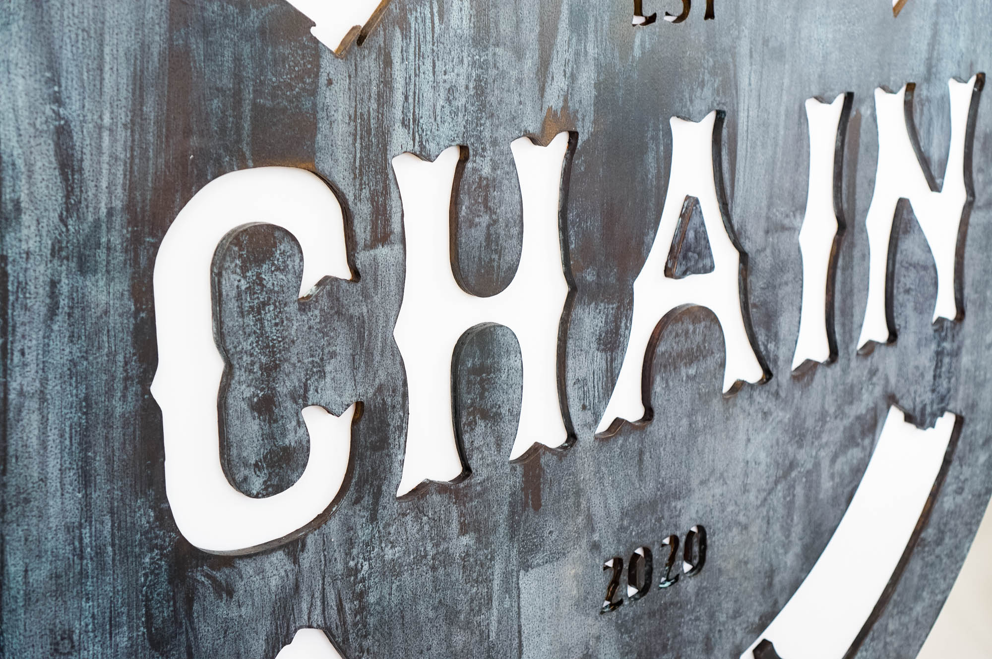 Faux rusty metal illuminated sign for Chain, a cycling studio in Styles Studios Fitness, a fitness club in Peoria, IL. Faux rusty metal illuminated sign for Chain, a cycling studio in Styles Studios Fitness, a fitness club in Peoria, IL.