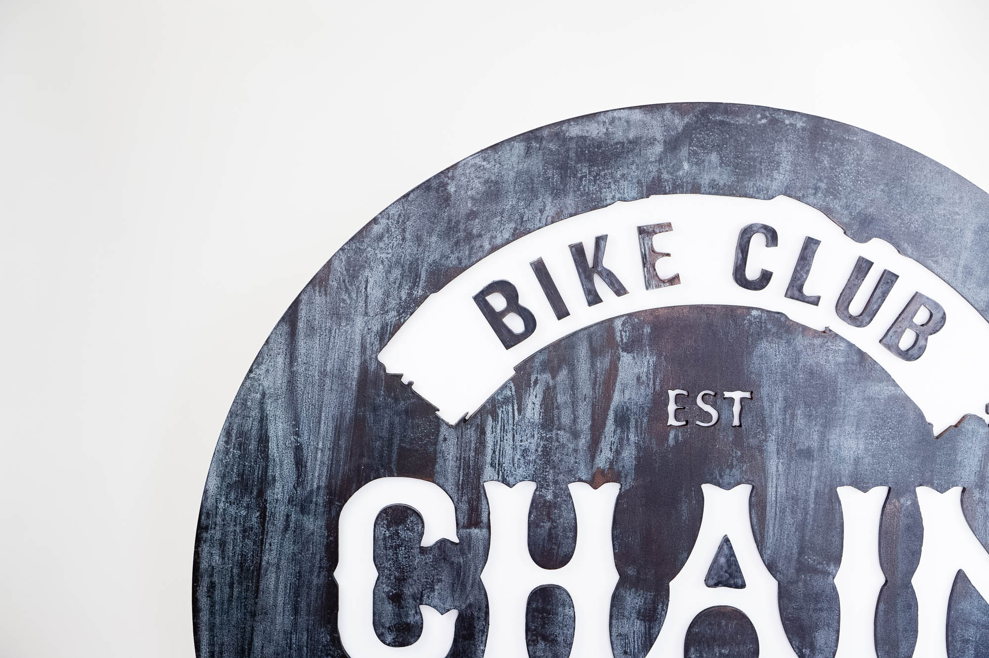 Faux rusty metal illuminated sign for Chain, a cycling studio in Styles Studios Fitness, a fitness club in Peoria, IL. Faux rusty metal illuminated sign for Chain, a cycling studio in Styles Studios Fitness, a fitness club in Peoria, IL.