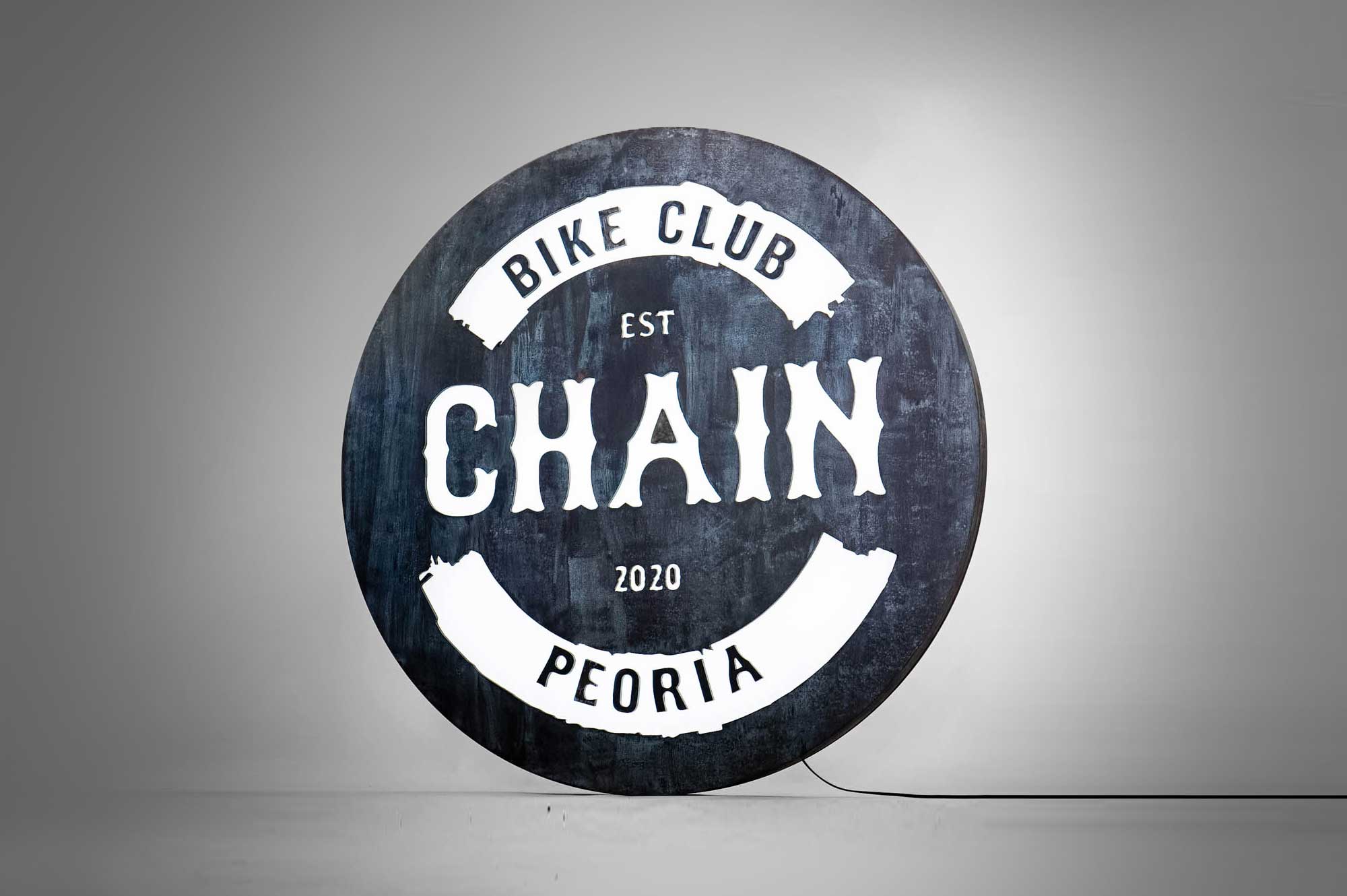 Faux rusty metal illuminated sign for Chain, a cycling studio in Styles Studios Fitness, a fitness club in Peoria, IL. Faux rusty metal illuminated sign for Chain, a cycling studio in Styles Studios Fitness, a fitness club in Peoria, IL.