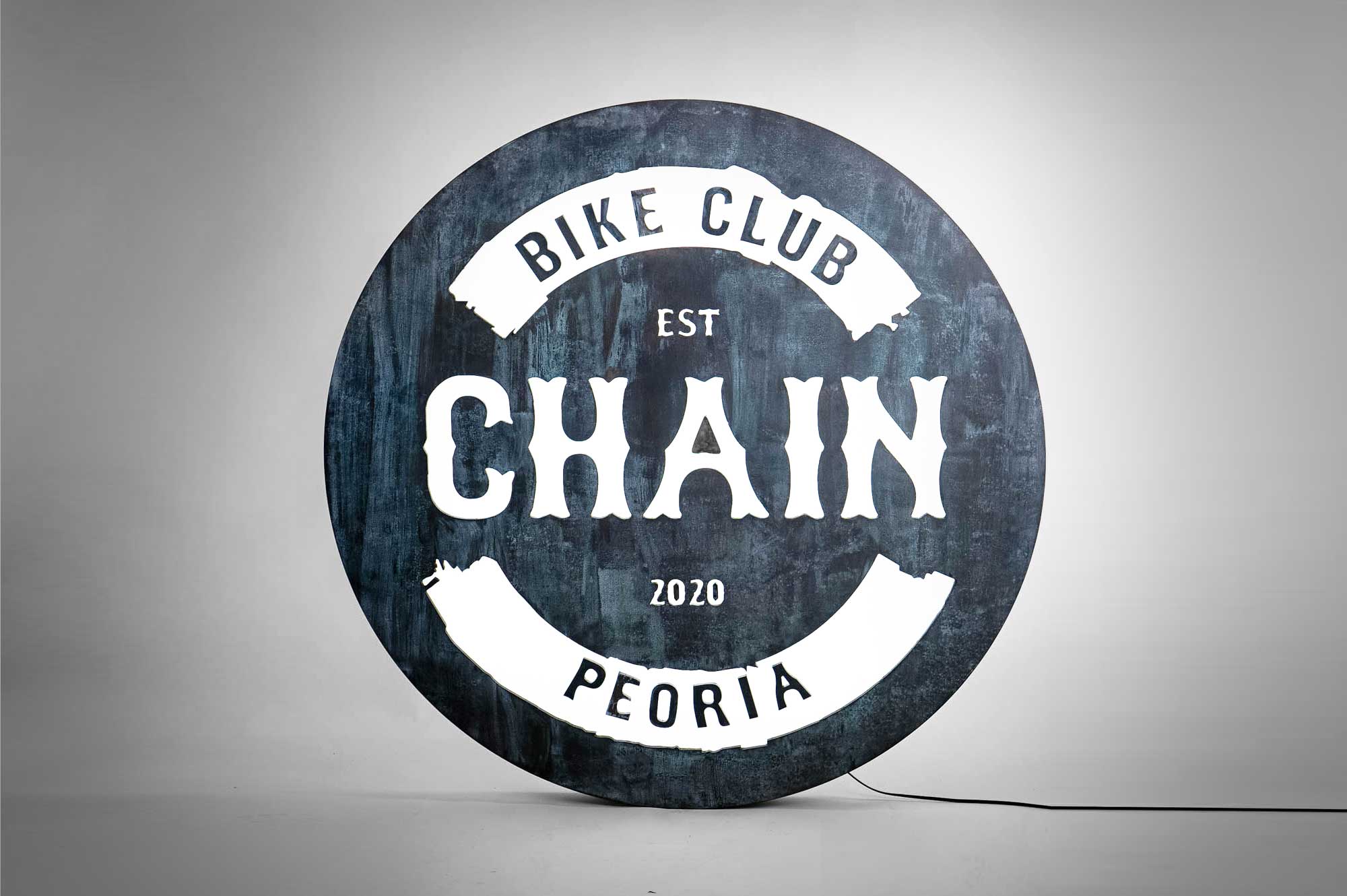 Faux rusty metal illuminated sign for Chain, a cycling studio in Styles Studios Fitness, a fitness club in Peoria, IL. Faux rusty metal illuminated sign for Chain, a cycling studio in Styles Studios Fitness, a fitness club in Peoria, IL.