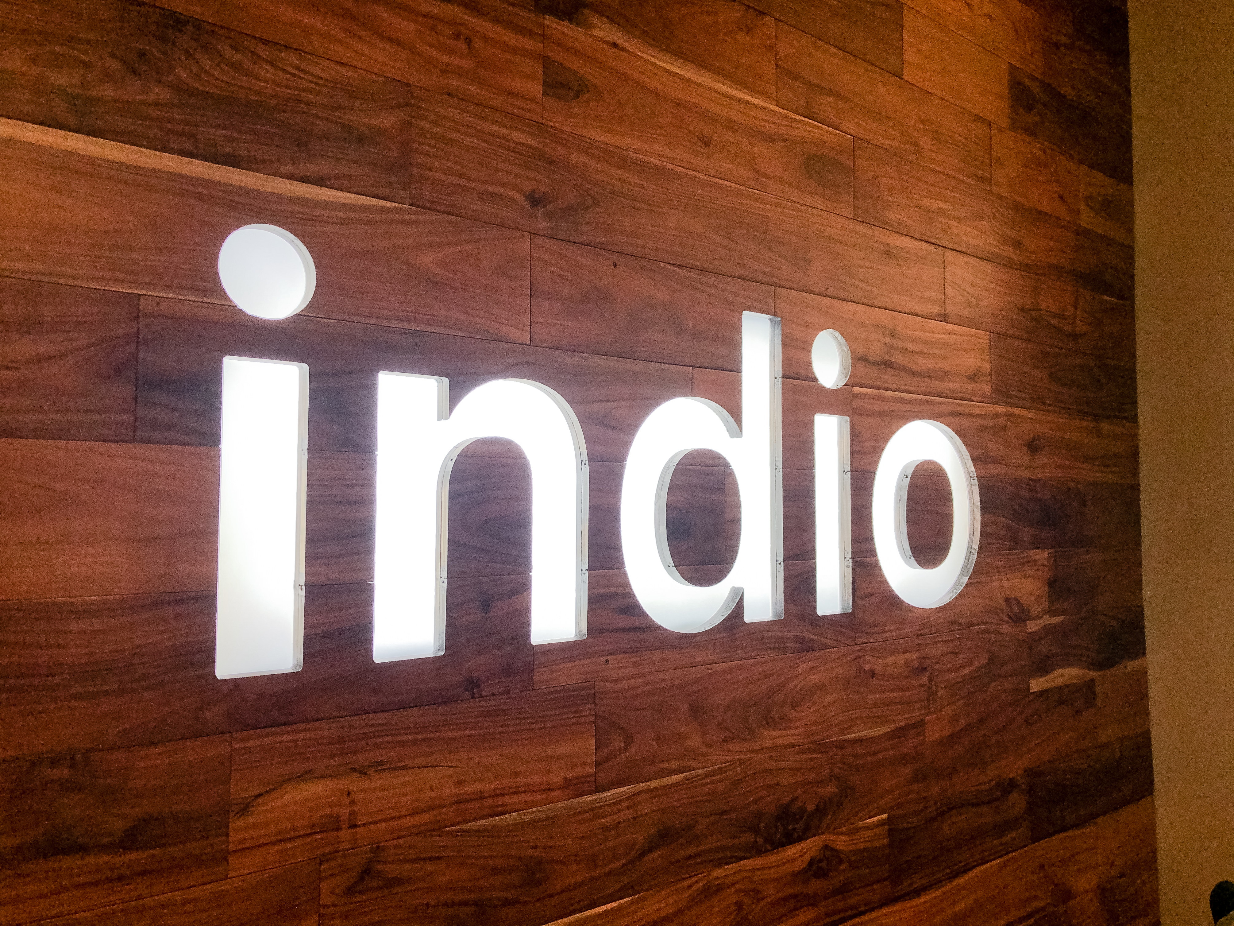 Full wall installation with dark wood and an illuminated, built-in logo for the San Francisco lobby of Indio, a company that simplifies the insurance application process for brokers and their clients. Full wall installation with dark wood and an illuminated, built-in logo for the San Francisco lobby of Indio, a company that simplifies the insurance application process for brokers and their clients.