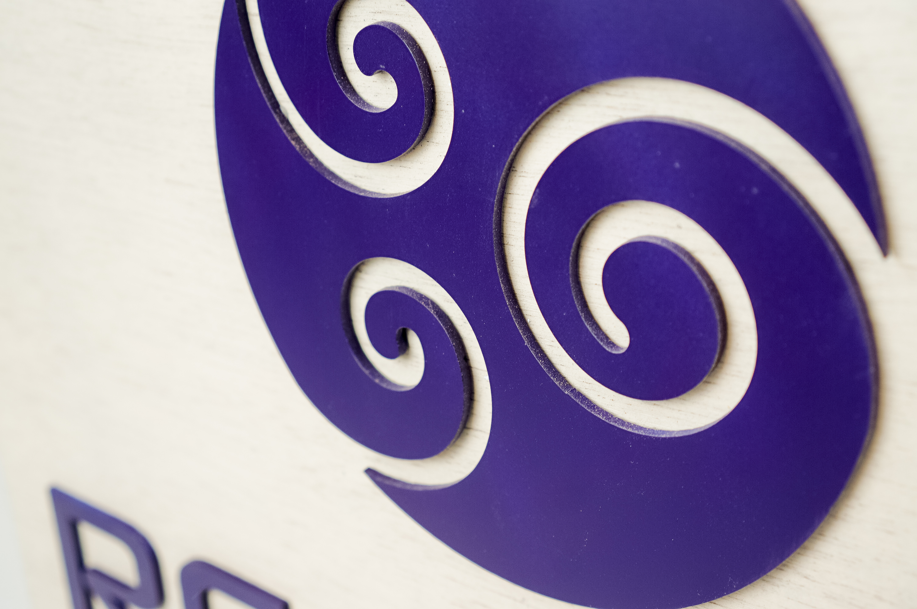 Hanging wood blade sign with purple logo for Remedy Barre and Foam Rolling, an independent studio offering barre & foam-roller stretching classes in Oakland CA. Hanging wood blade sign with purple logo for Remedy Barre and Foam Rolling, an independent studio offering barre & foam-roller stretching classes in Oakland CA.