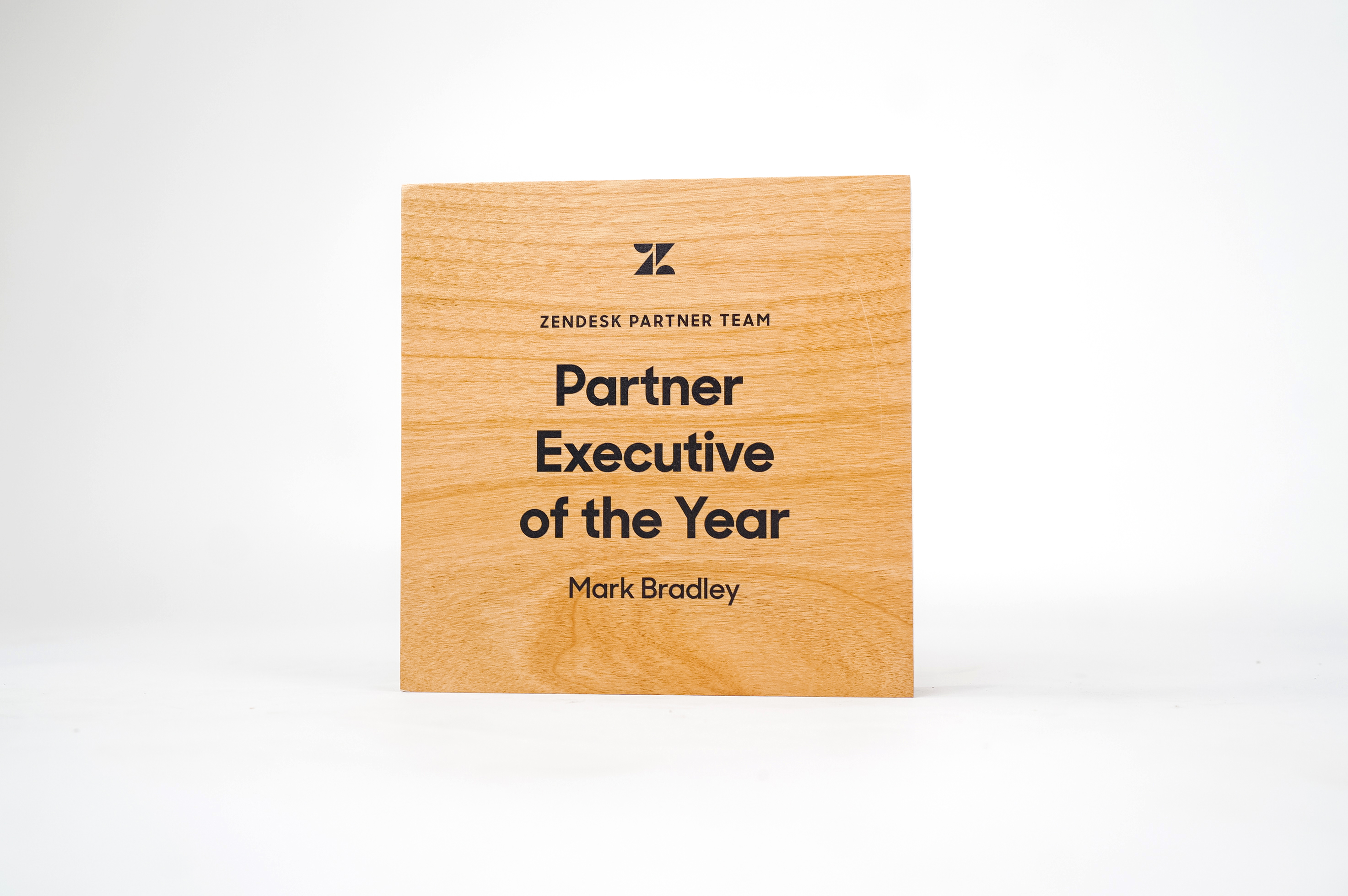 Simple, solid light wood, executive of the year award for Zendesk, a customer service software company headquartered in San Francisco, California.