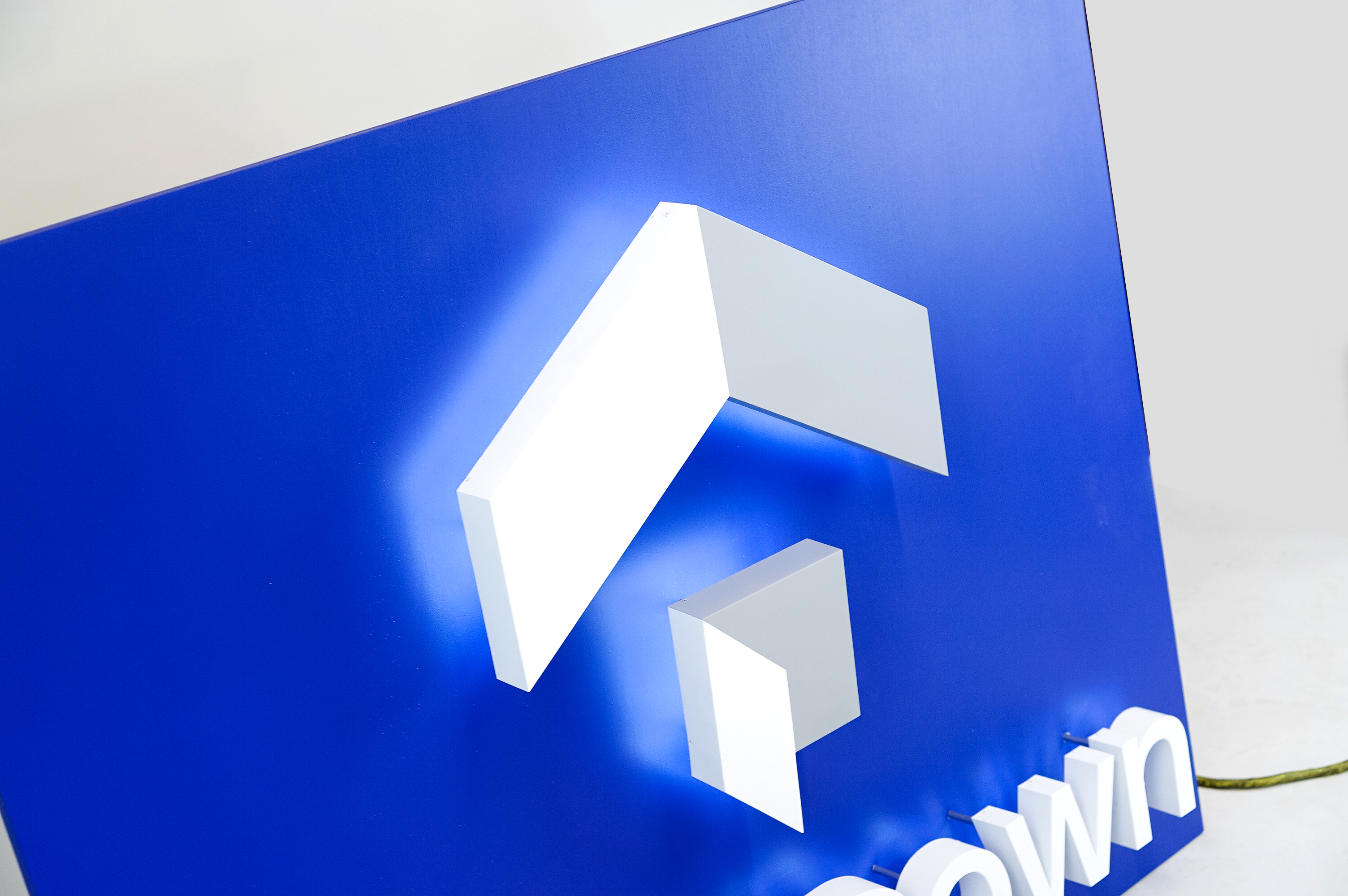 Back-lit, illuminated blue and white lobby sign for Zerodown, a company that couples technology and a debt-fueled real estate fund to allow home-buyers to forgo the traditional down payment process required to purchase a home. Back-lit, illuminated blue and white lobby sign for Zerodown, a company that couples technology and a debt-fueled real estate fund to allow home-buyers to forgo the traditional down payment process required to purchase a home.