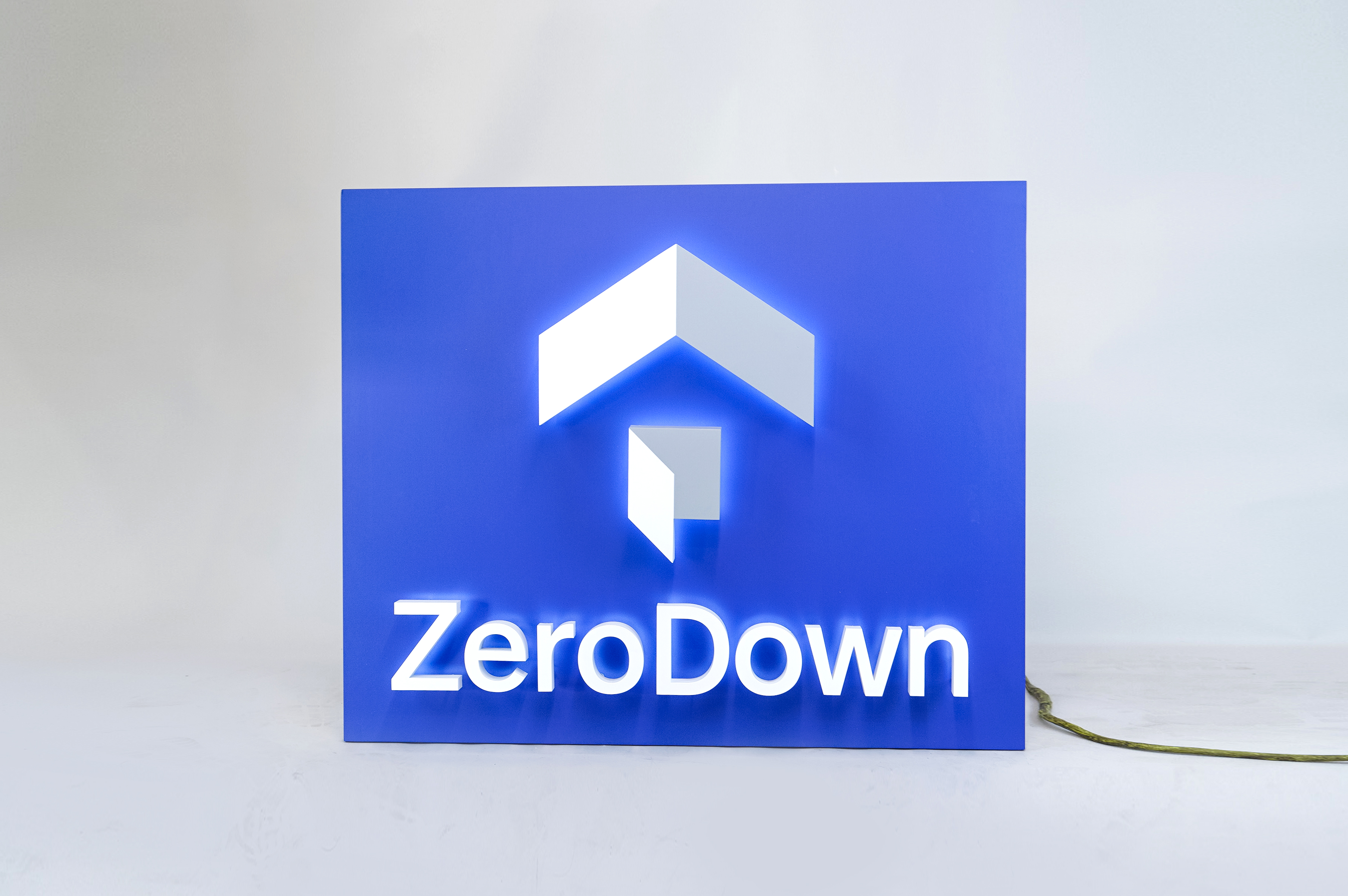 Back-lit, illuminated blue and white lobby sign for Zerodown, a company that couples technology and a debt-fueled real estate fund to allow home-buyers to forgo the traditional down payment process required to purchase a home. Back-lit, illuminated blue and white lobby sign for Zerodown, a company that couples technology and a debt-fueled real estate fund to allow home-buyers to forgo the traditional down payment process required to purchase a home.