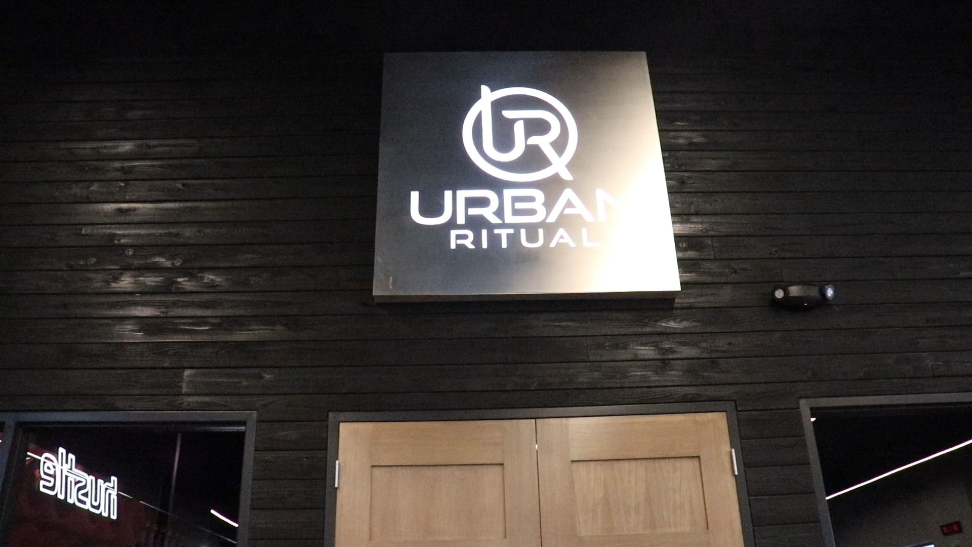 Brushed steel, interior-lit, large square wall sign for Urban Ritual, a fitness studio located in Styles Studios, a boutique fitness studio in Peoria, IL. Brushed steel, interior-lit, large square wall sign for Urban Ritual, a fitness studio located in Styles Studios, a boutique fitness studio in Peoria, IL.