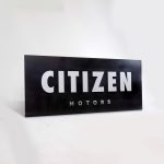 Black sign with silver letters for Citizen Motors, a shop that builds and restores classic vehicles in the San Francisco Bay Area.