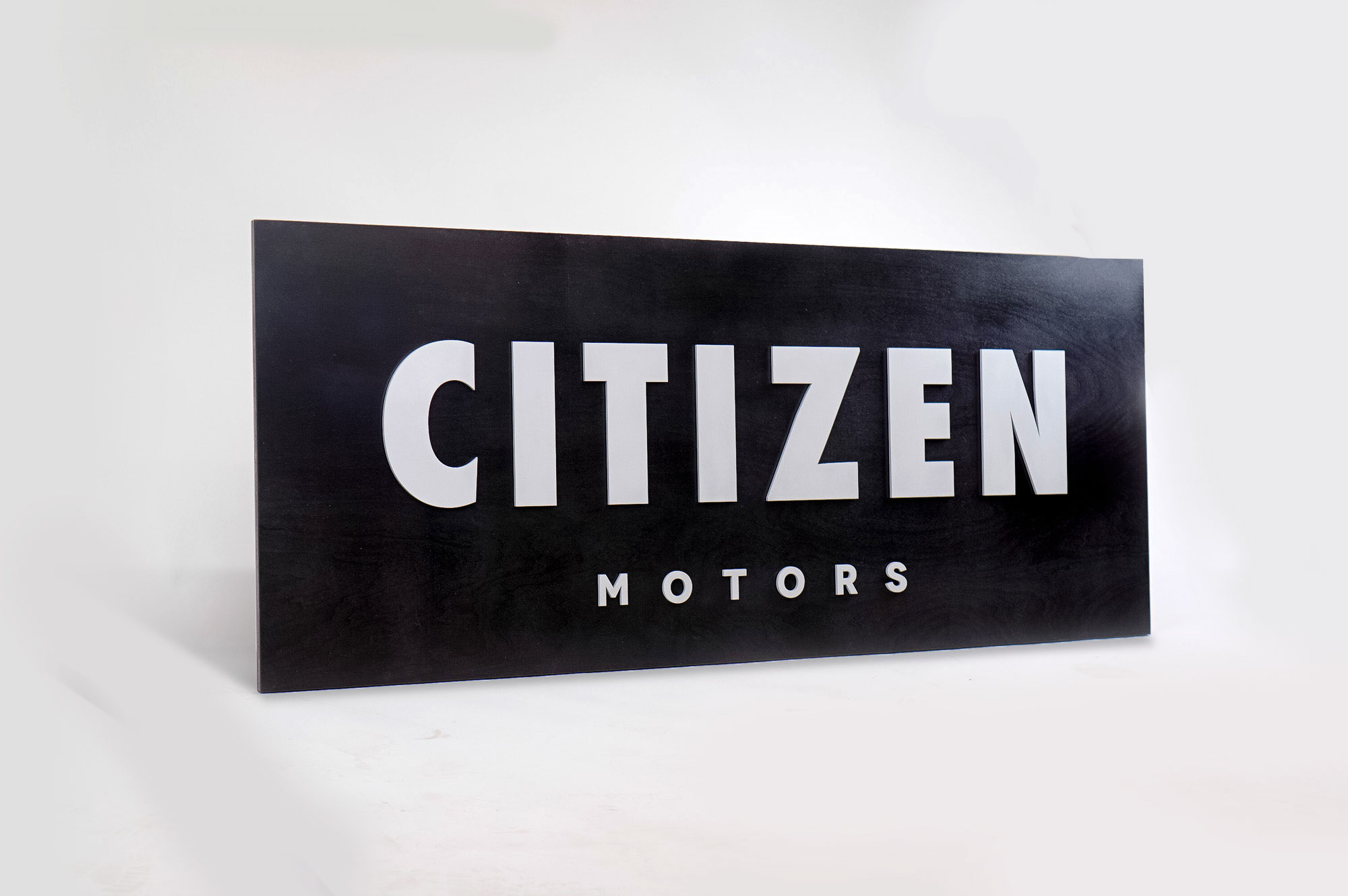 Black sign with silver letters for Citizen Motors, a shop that builds and restores classic vehicles in the San Francisco Bay Area. Black sign with silver letters for Citizen Motors, a shop that builds and restores classic vehicles in the San Francisco Bay Area.
