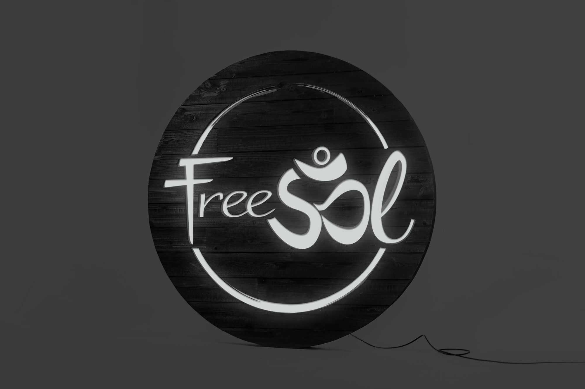 Torched wood, interior-lit, large circular wall sign for FreeSol, a fitness studio located in Styles Studios, a boutique fitness studio in Peoria, IL. Torched wood, interior-lit, large circular wall sign for FreeSol, a fitness studio located in Styles Studios, a boutique fitness studio in Peoria, IL.