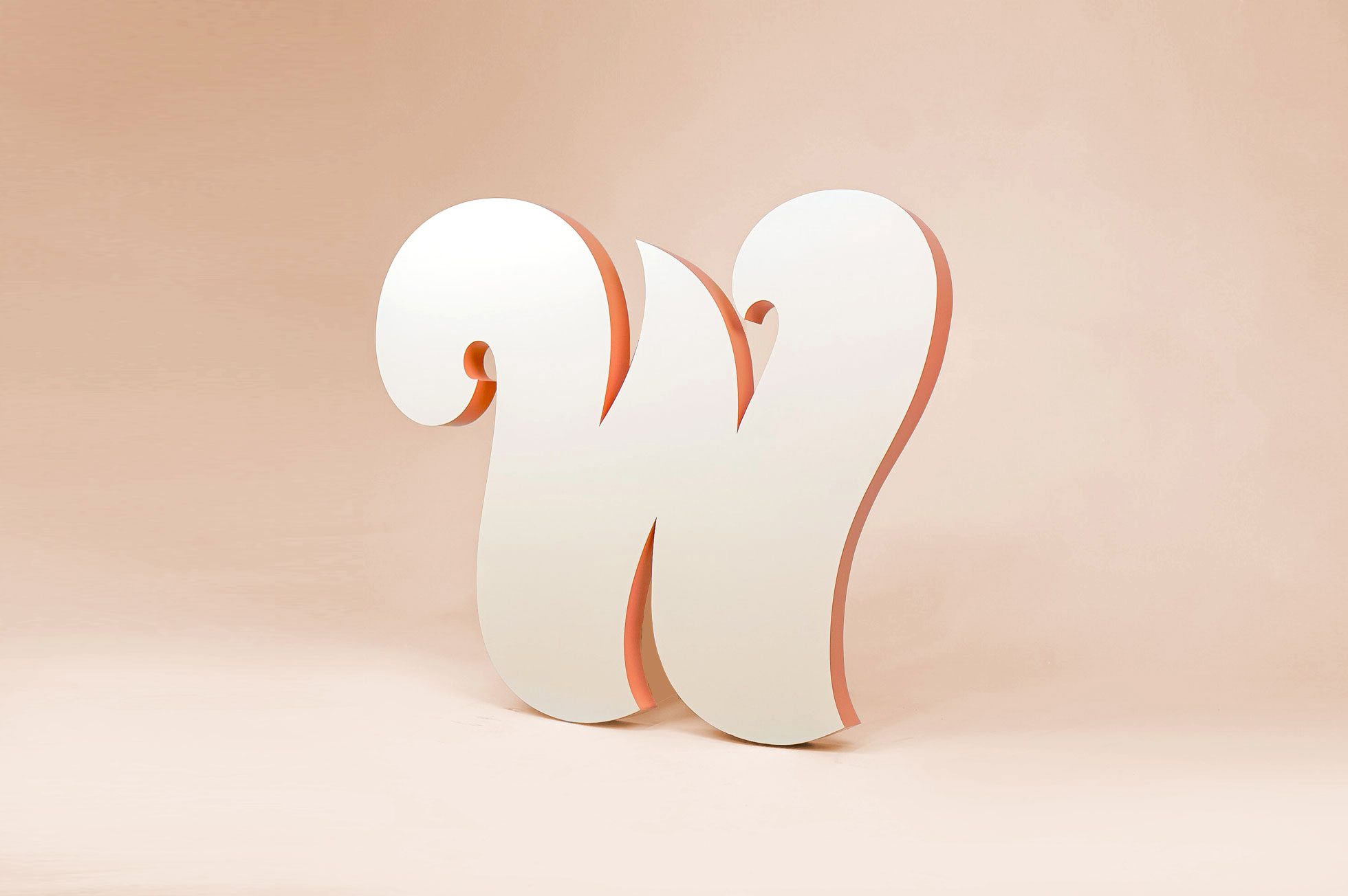 "W" wing logo in tone-on-tone paint with contrasting edges for the lobby of the Williamsburg location of The Wing, a co-working space for women.