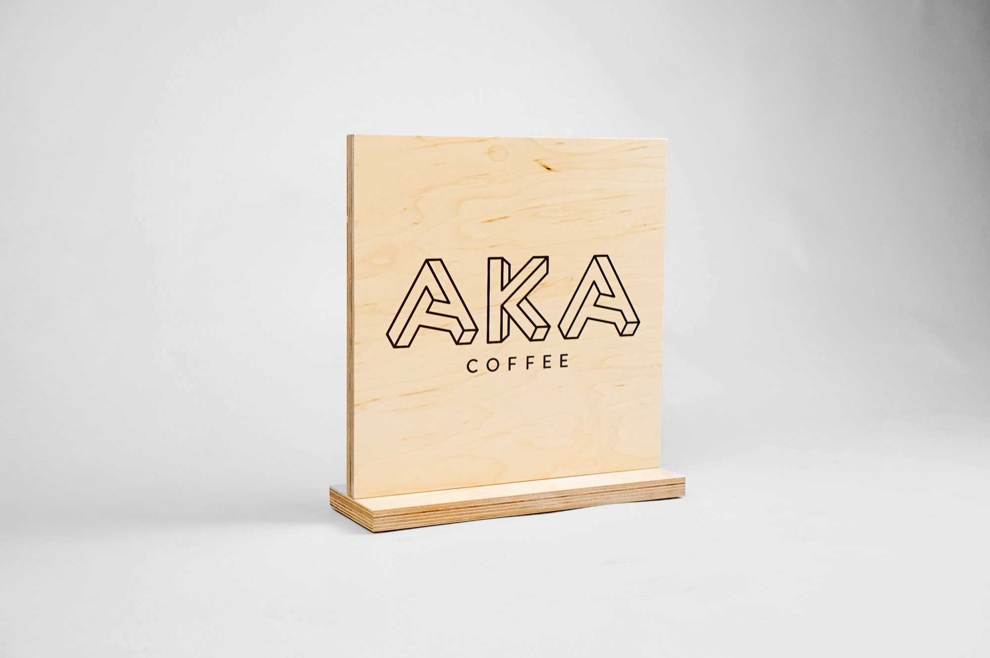 Wood tabletop sign for coffee popup at Square headquarters for AKA coffee, a coffee roastery based out of Oakland, CA. Wood tabletop sign for coffee popup at Square headquarters for AKA coffee, a coffee roastery based out of Oakland, CA.