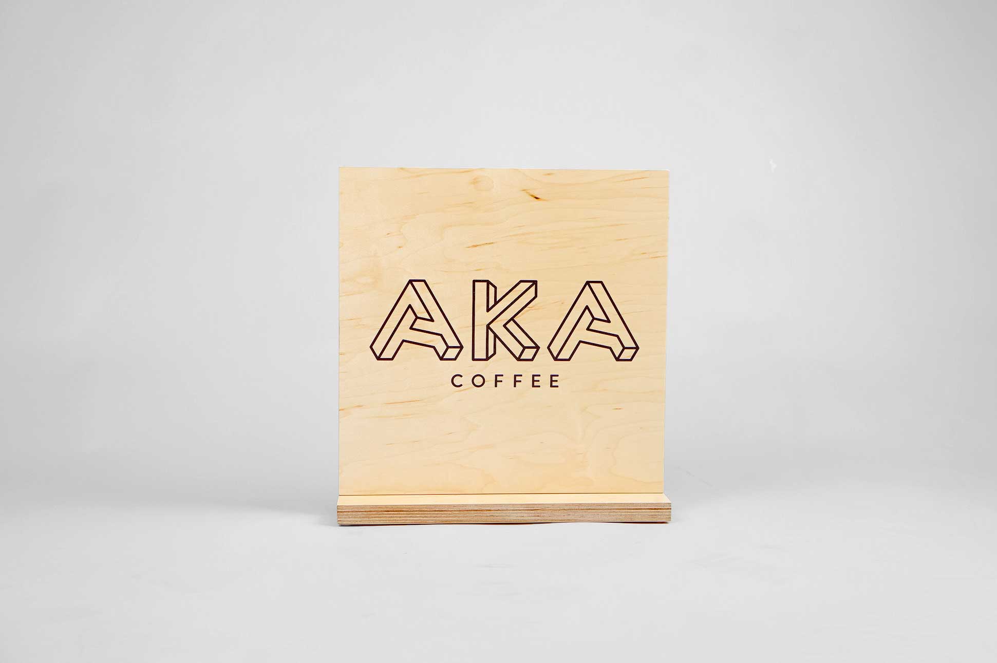 Wood tabletop sign for coffee popup at Square headquarters for AKA coffee, a coffee roastery based out of Oakland, CA. Wood tabletop sign for coffee popup at Square headquarters for AKA coffee, a coffee roastery based out of Oakland, CA.