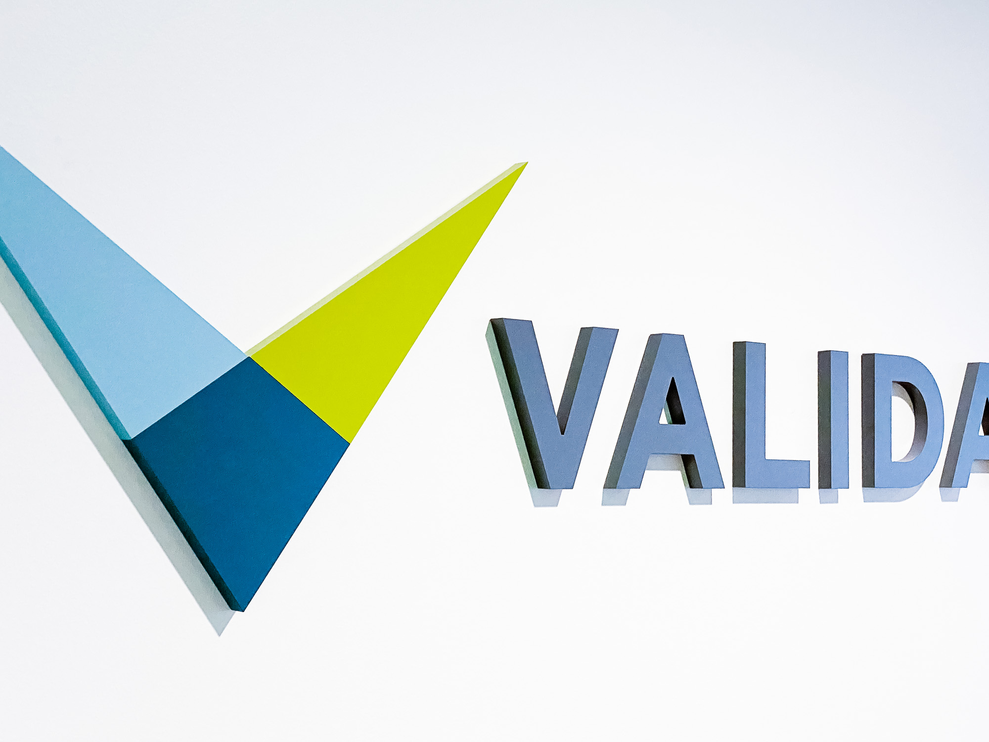 Full color dimensional logo on white wall for the lobby of Validant, a San Francisco based company that delivers end-to-end quality, compliance, and regulatory consulting service for healthcare companies around the world. Full color dimensional logo on white wall for the lobby of Validant, a San Francisco based company that delivers end-to-end quality, compliance, and regulatory consulting service for healthcare companies around the world.