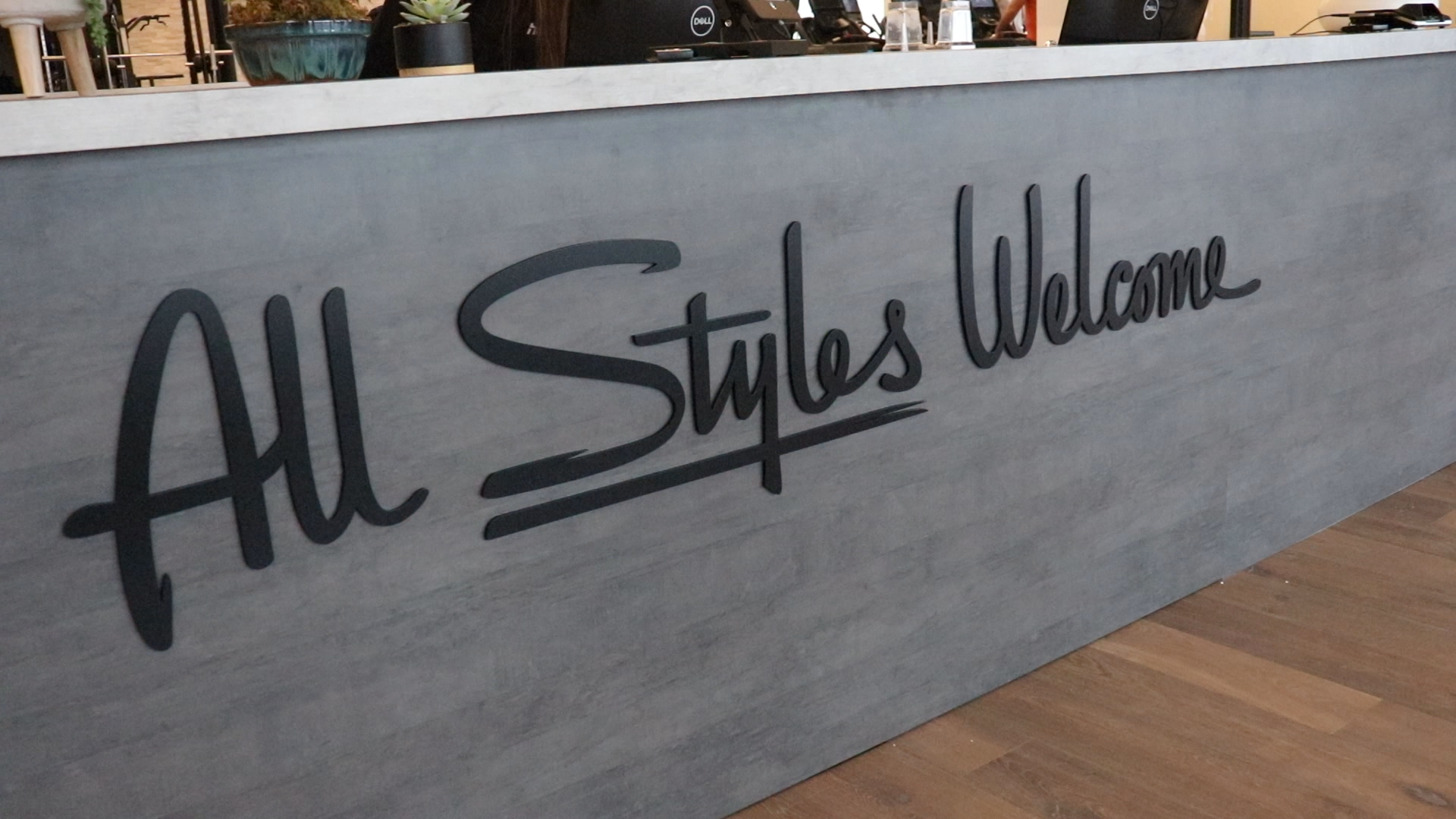 Black script front desk sign for the lobby at Styles Studios, a fitness club in Peoria, IL. Black script front desk sign for the lobby at Styles Studios, a fitness club in Peoria, IL.