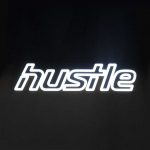 Neon style sign for Hustle, a strength and cardio studio inside Styles Studios, a fitness club in Peoria, IL.