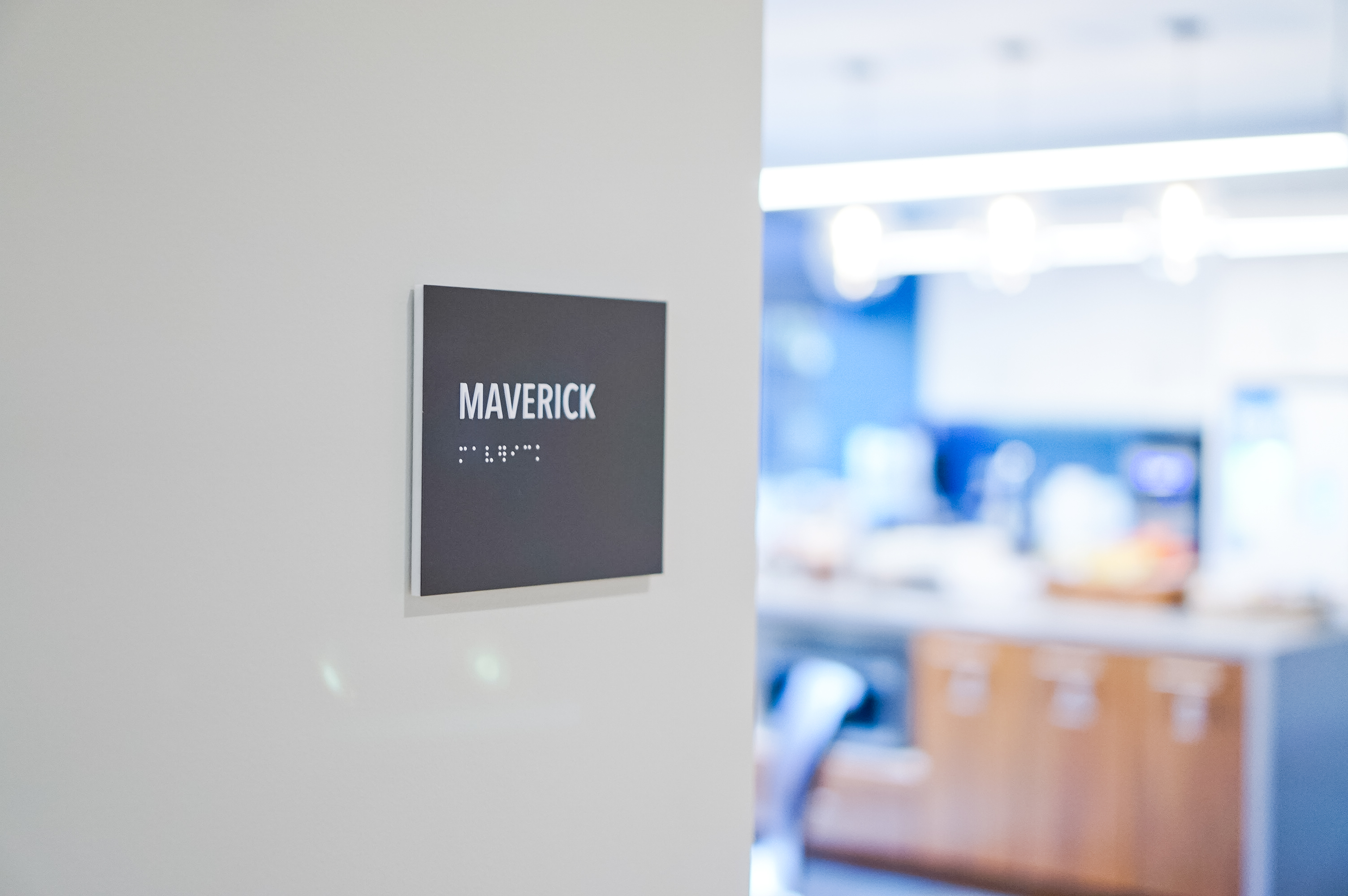 Minimal grey office ADA room signs for Baker McKenzie, a multinational law firm.