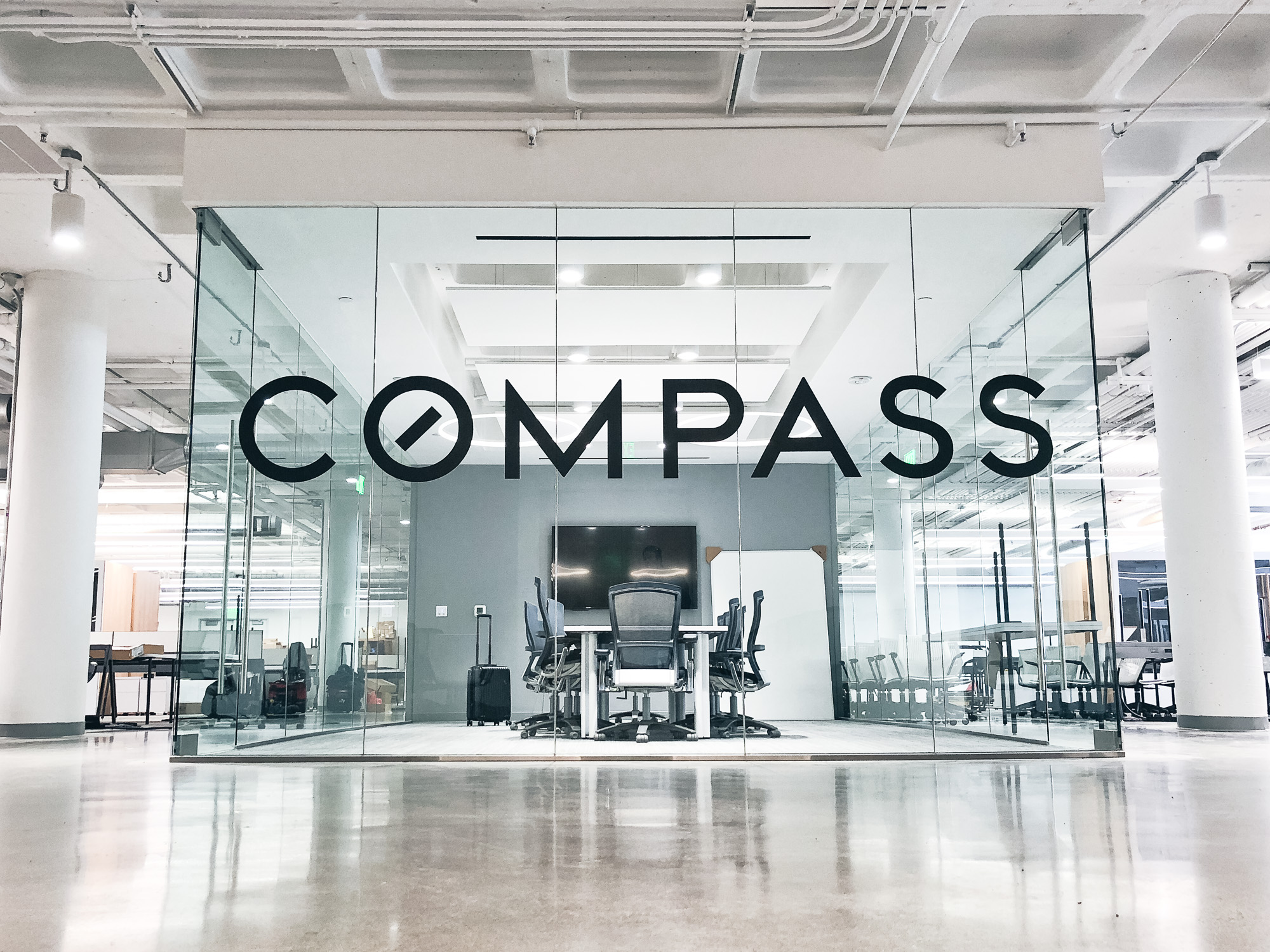 Glass vinyl sign / privacy screen at the San Francisco office of Compass, a modern real estate platform. Glass vinyl sign / privacy screen at the San Francisco office of Compass, a modern real estate platform.