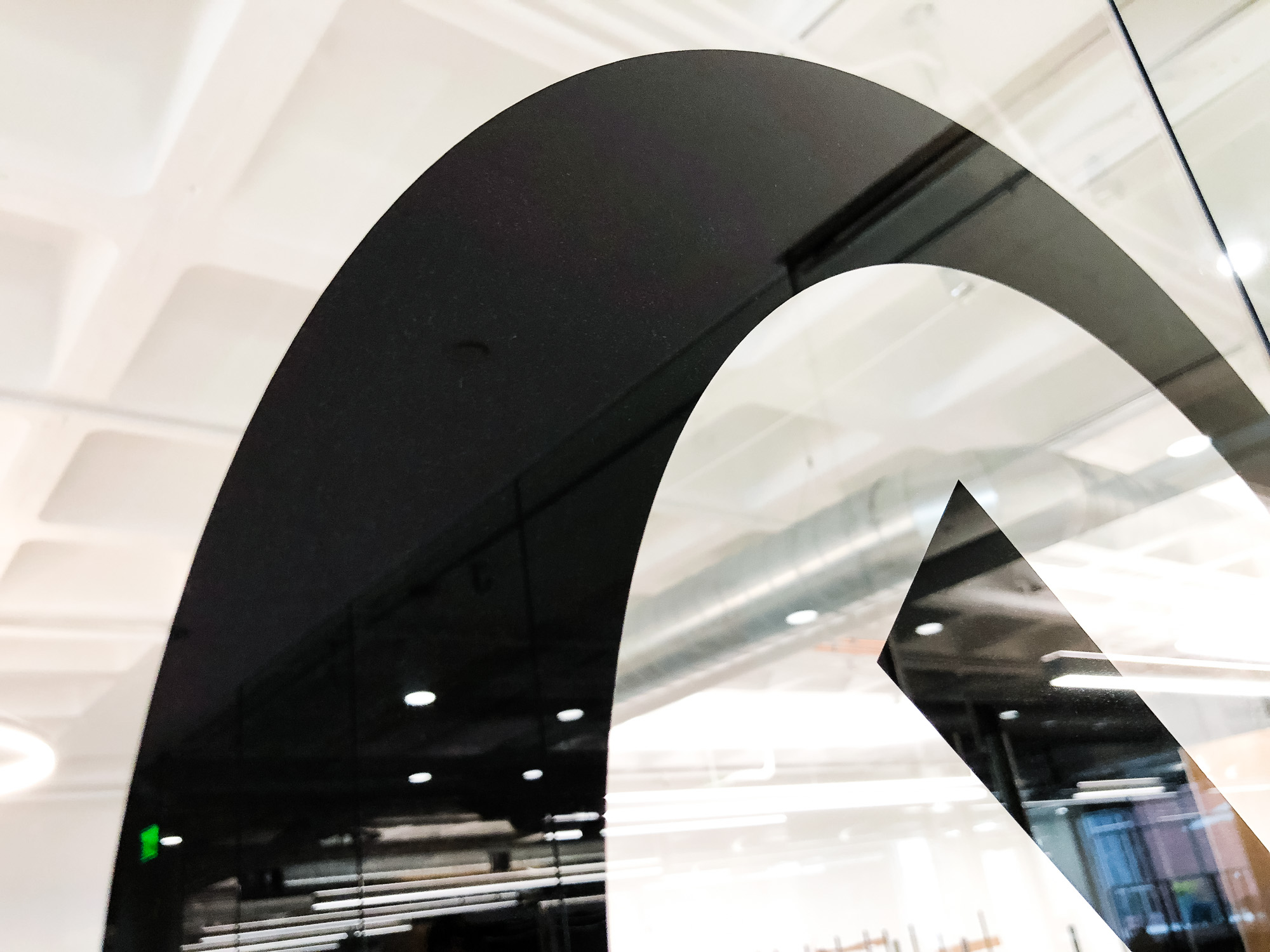 Glass vinyl sign / privacy screen at the San Francisco office of Compass, a modern real estate platform. Glass vinyl sign / privacy screen at the San Francisco office of Compass, a modern real estate platform.