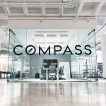 Glass vinyl sign / privacy screen at the San Francisco office of Compass, a modern real estate platform.