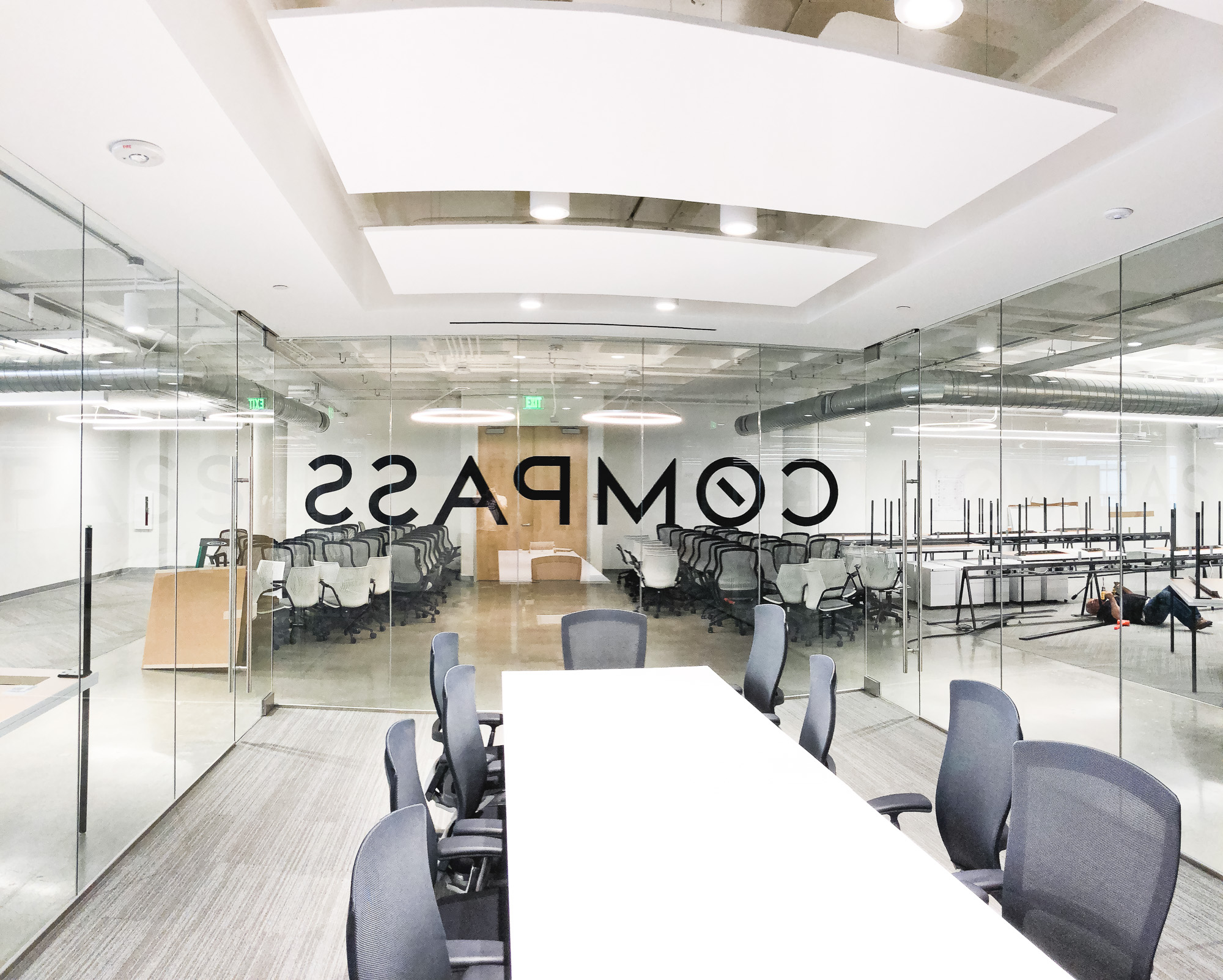Glass vinyl sign / privacy screen at the San Francisco office of Compass, a modern real estate platform. Glass vinyl sign / privacy screen at the San Francisco office of Compass, a modern real estate platform.
