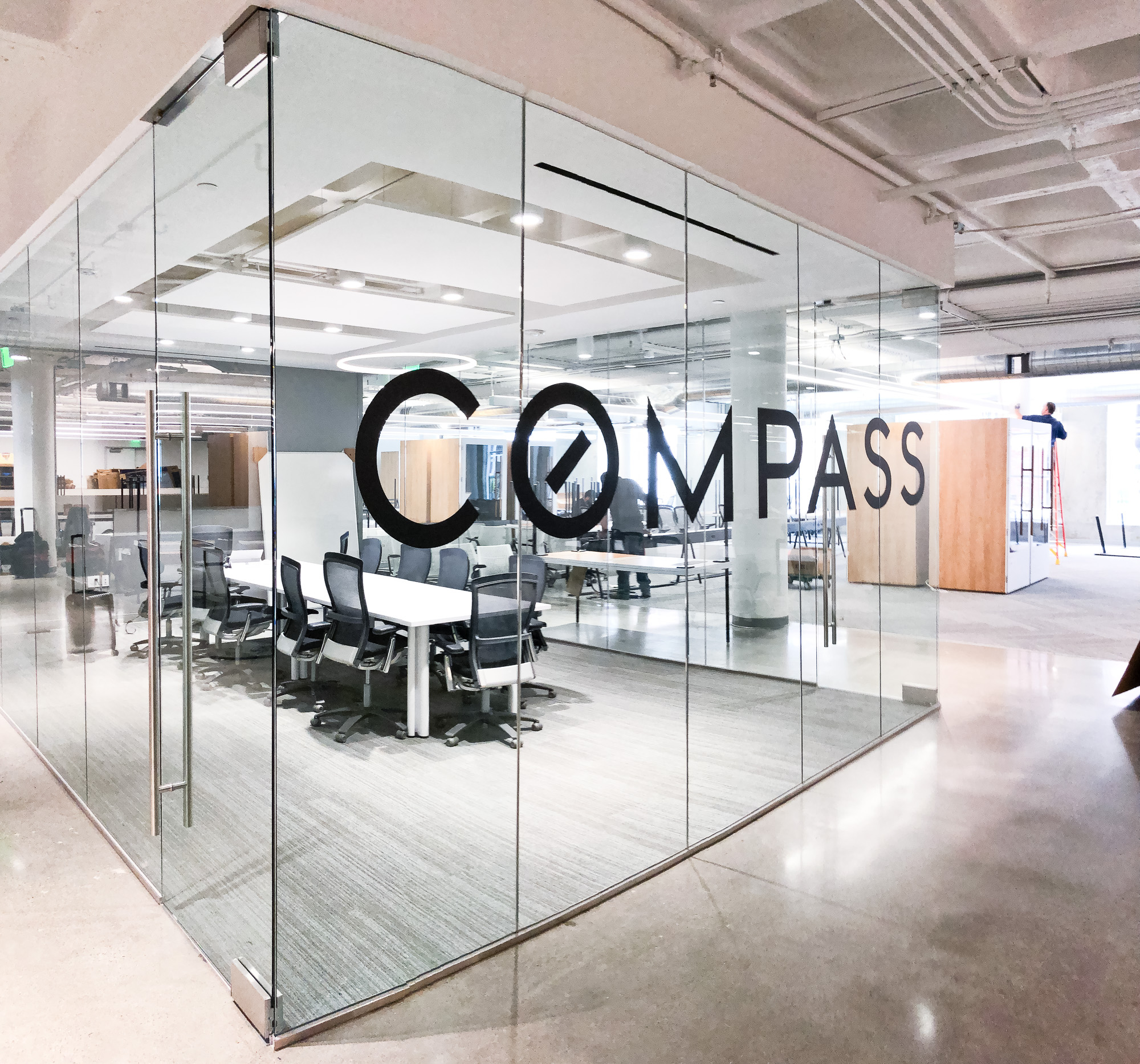 Glass vinyl sign / privacy screen at the San Francisco office of Compass, a modern real estate platform. Glass vinyl sign / privacy screen at the San Francisco office of Compass, a modern real estate platform.