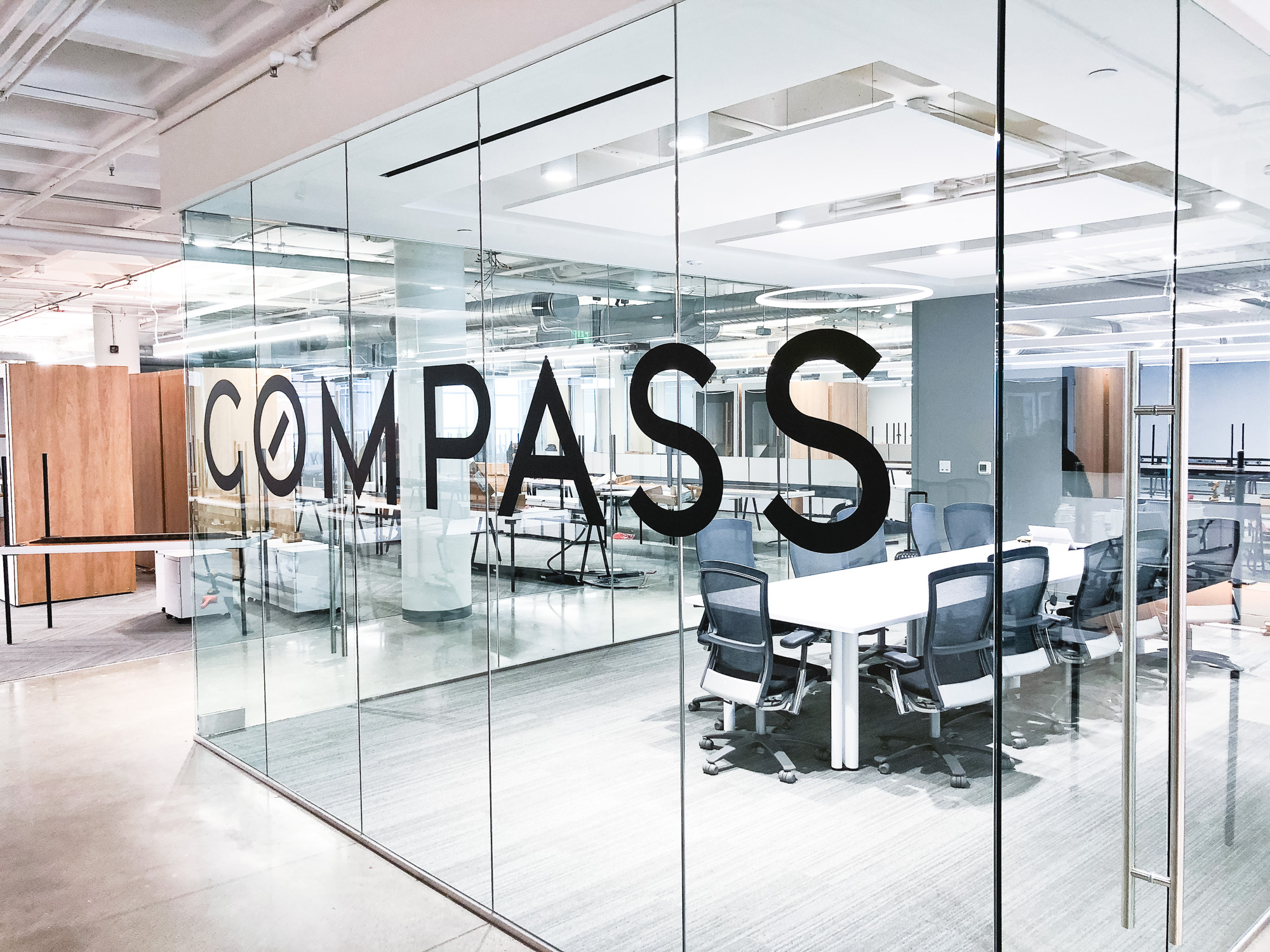Glass vinyl sign / privacy screen at the San Francisco office of Compass, a modern real estate platform. Glass vinyl sign / privacy screen at the San Francisco office of Compass, a modern real estate platform.