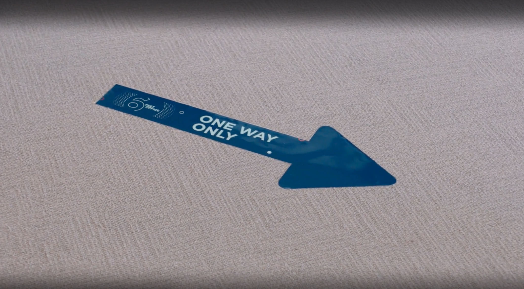 One way directional floor signs in post-covid office