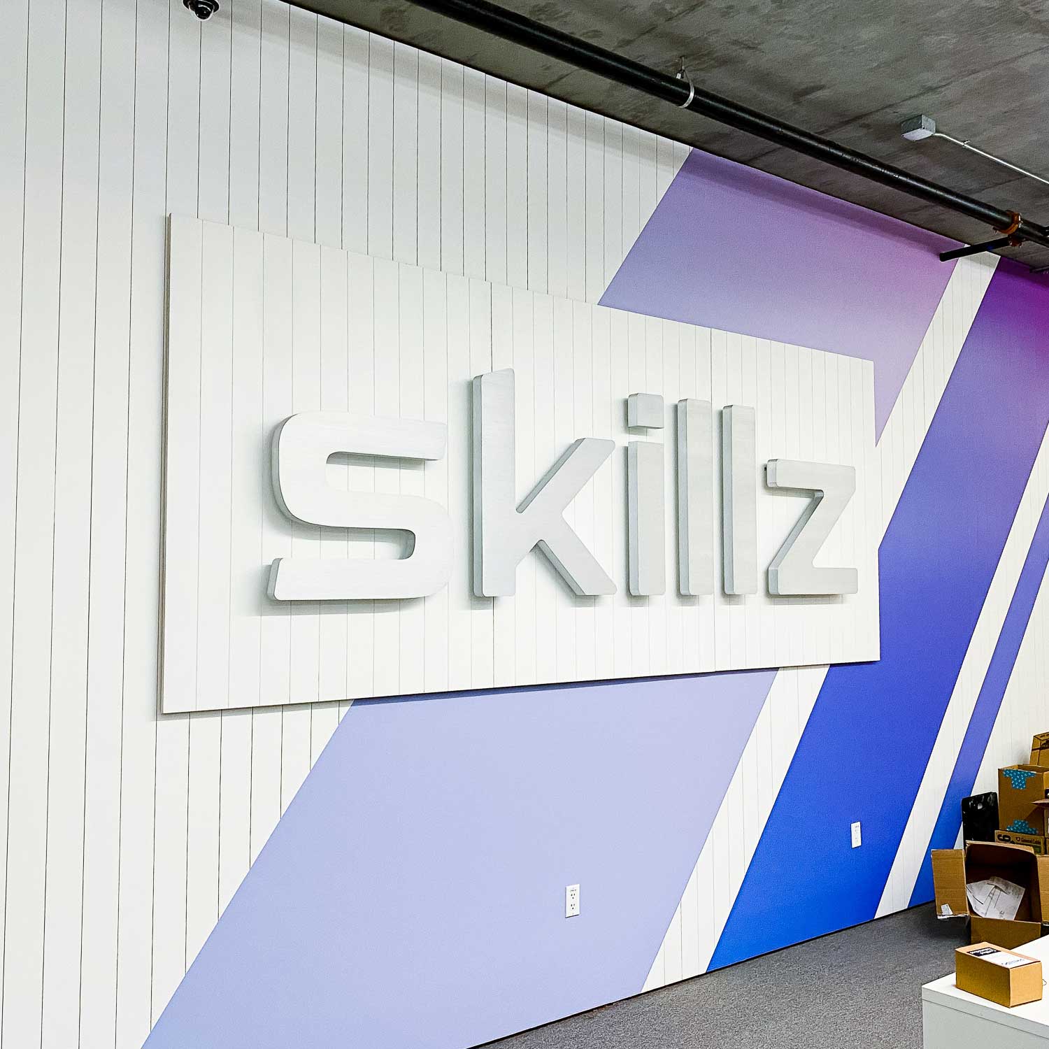 Illuminated metal sign for the reception desk at the San Francisco office of Skillz, an online mobile multiplayer competition platform. Illuminated metal sign for the reception desk at the San Francisco office of Skillz, an online mobile multiplayer competition platform.