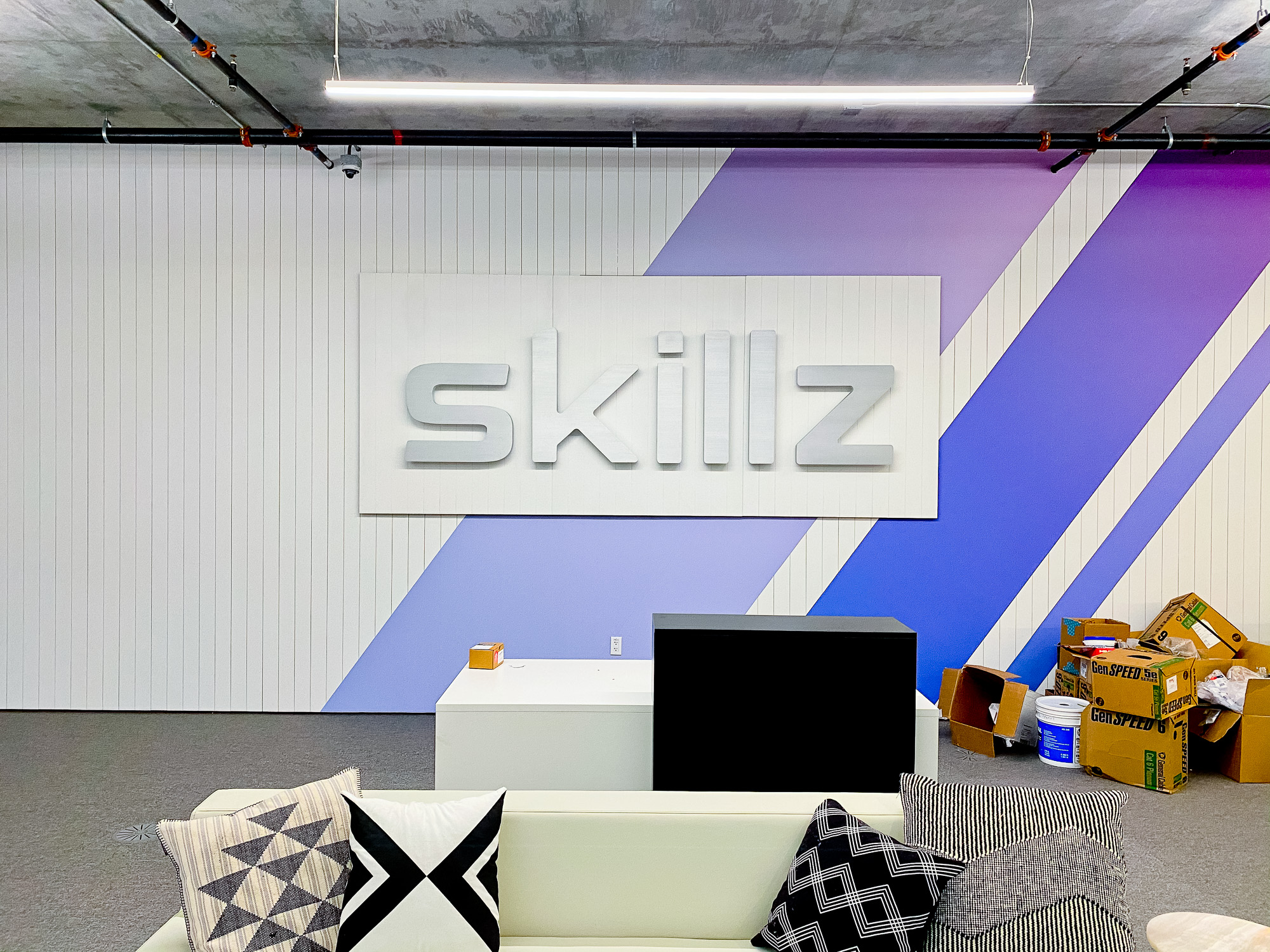 Illuminated metal sign for the reception desk at the San Francisco office of Skillz, an online mobile multiplayer competition platform.