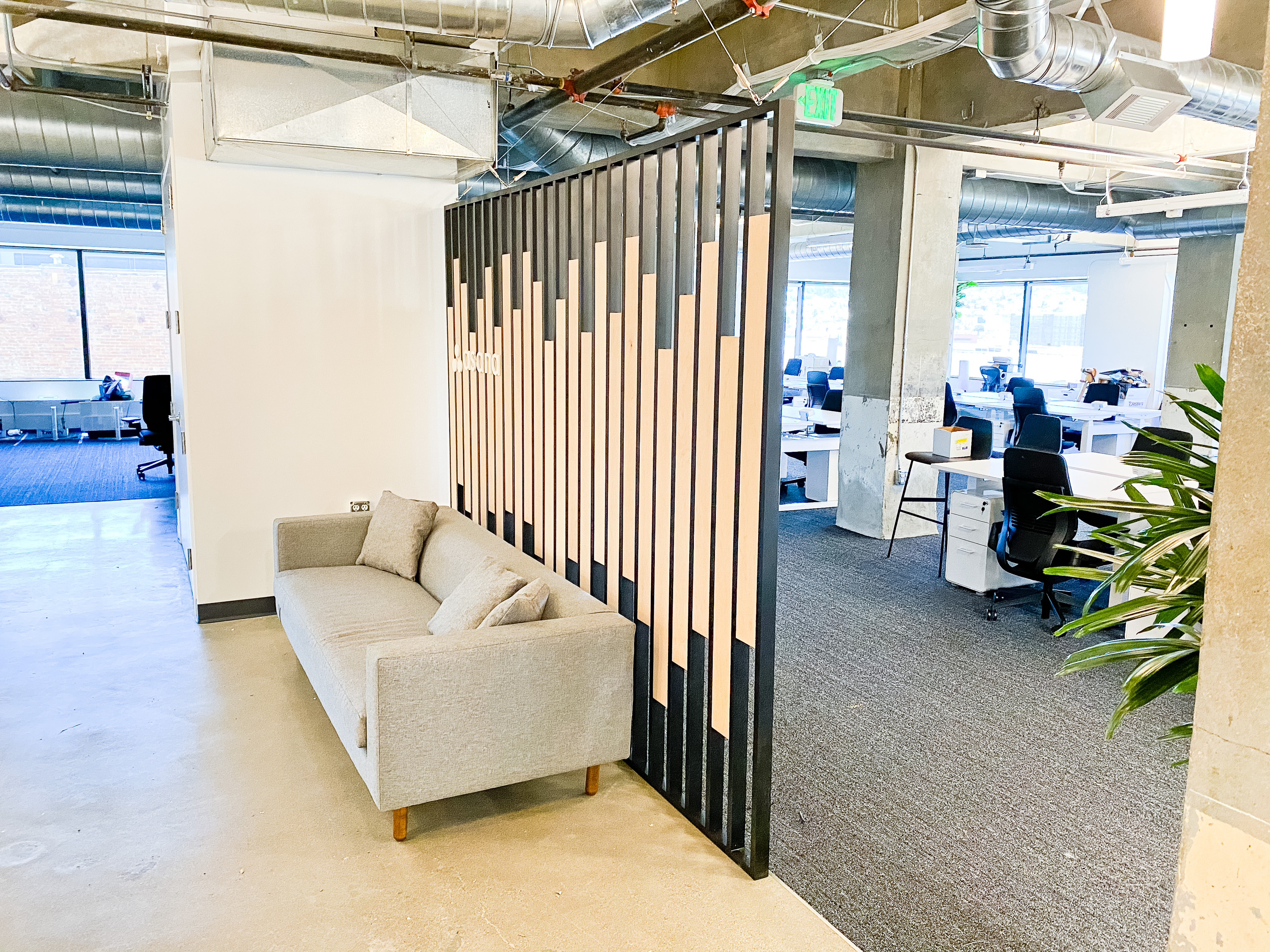Custom slat wood and metal divider wall for the San Francisco office of Asana, a web and mobile application designed to help teams organize, track, and manage their work. Custom slat wood and metal divider wall for the San Francisco office of Asana, a web and mobile application designed to help teams organize, track, and manage their work.