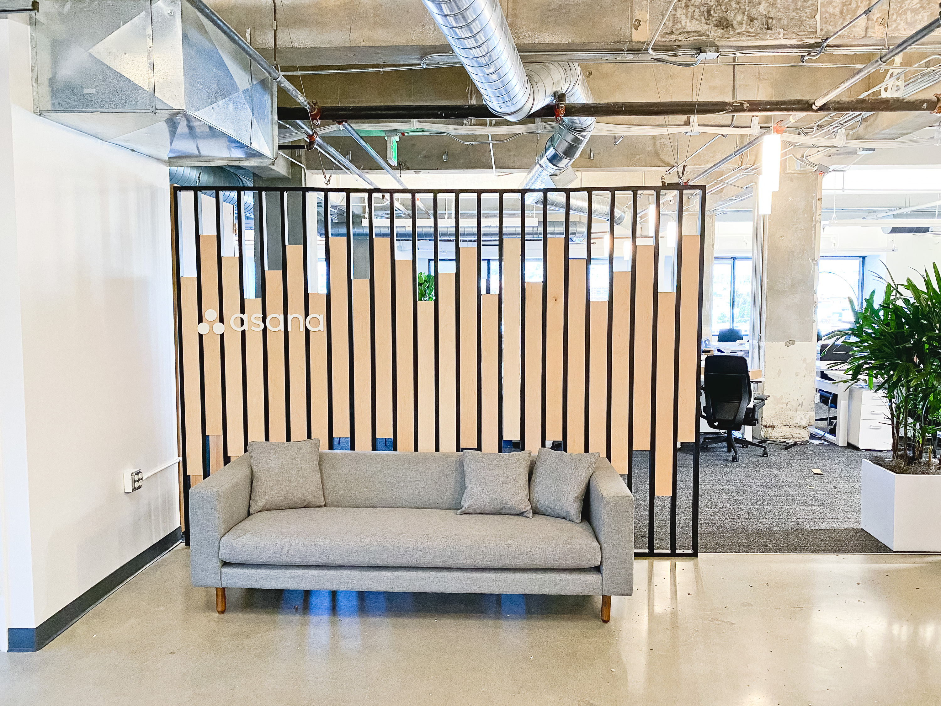 Custom slat wood and metal divider wall for the San Francisco office of Asana, a web and mobile application designed to help teams organize, track, and manage their work. Custom slat wood and metal divider wall for the San Francisco office of Asana, a web and mobile application designed to help teams organize, track, and manage their work.