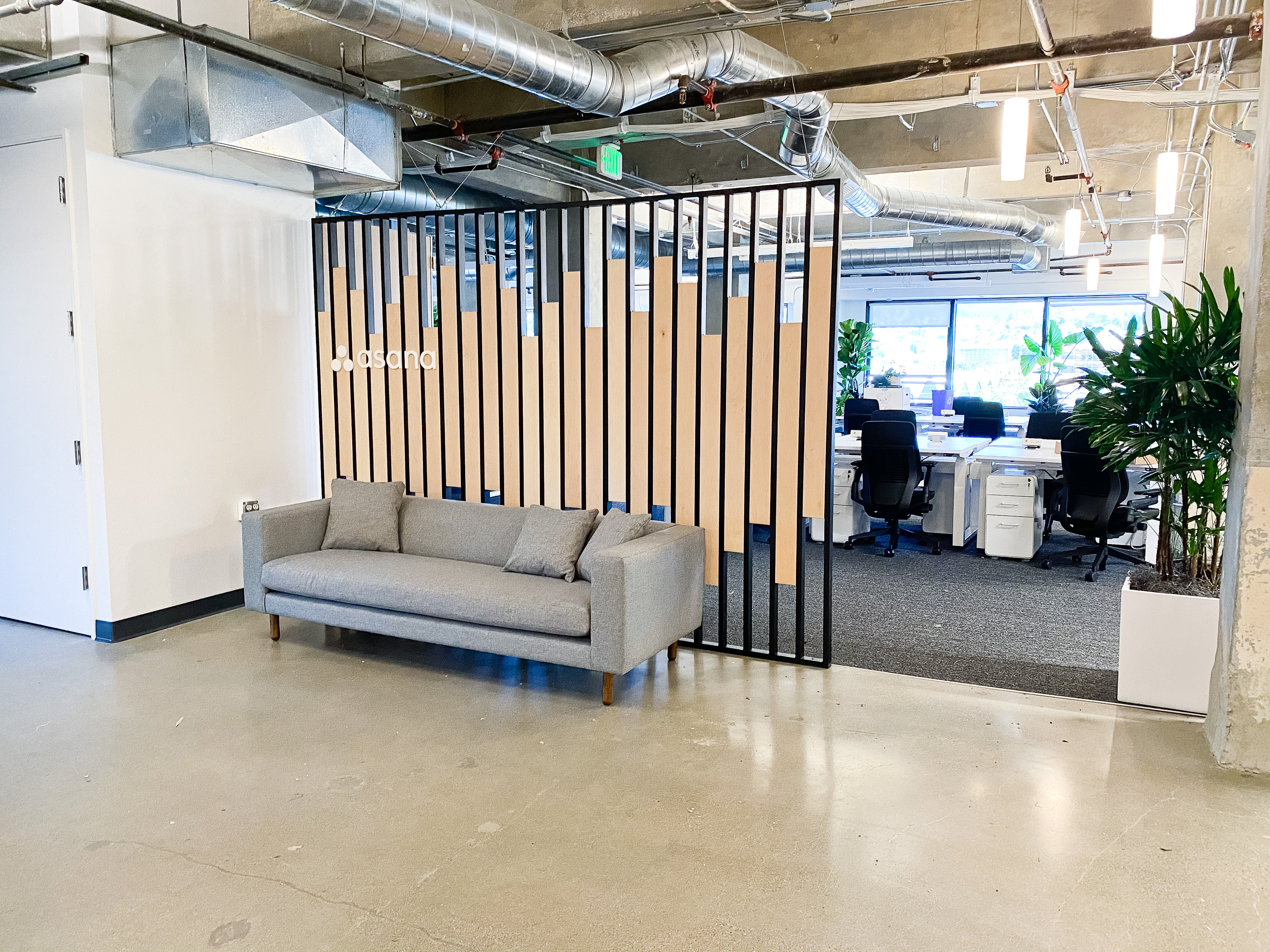 Custom slat wood and metal divider wall for the San Francisco office of Asana, a web and mobile application designed to help teams organize, track, and manage their work. Custom slat wood and metal divider wall for the San Francisco office of Asana, a web and mobile application designed to help teams organize, track, and manage their work.