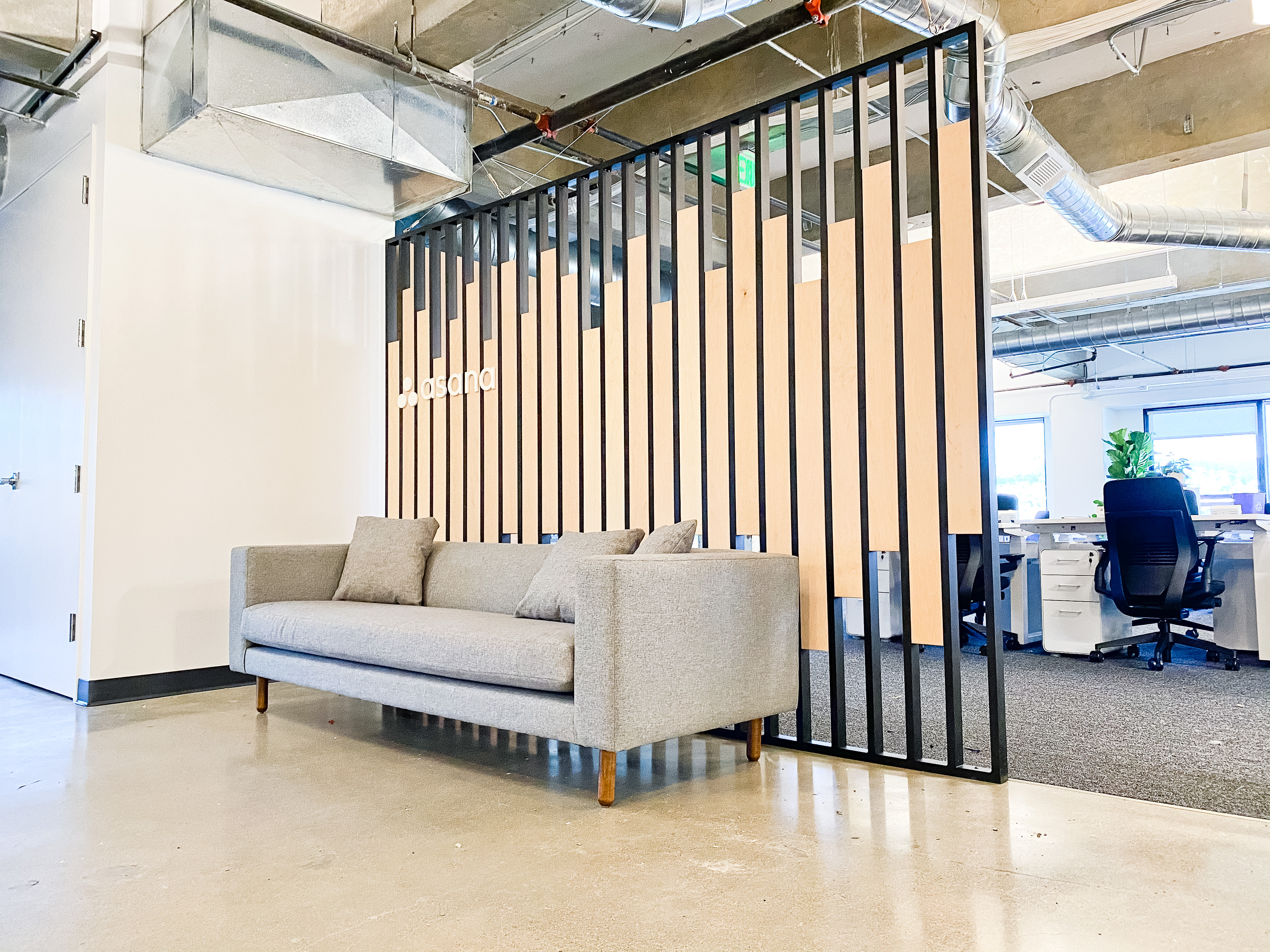 Custom slat wood and metal divider wall for the San Francisco office of Asana, a web and mobile application designed to help teams organize, track, and manage their work. Custom slat wood and metal divider wall for the San Francisco office of Asana, a web and mobile application designed to help teams organize, track, and manage their work.