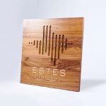 Solid walnut sign with engraved and inlaid logo for Estes Audiology, one of the largest independent hearing device practices in the Texas Hill Country.