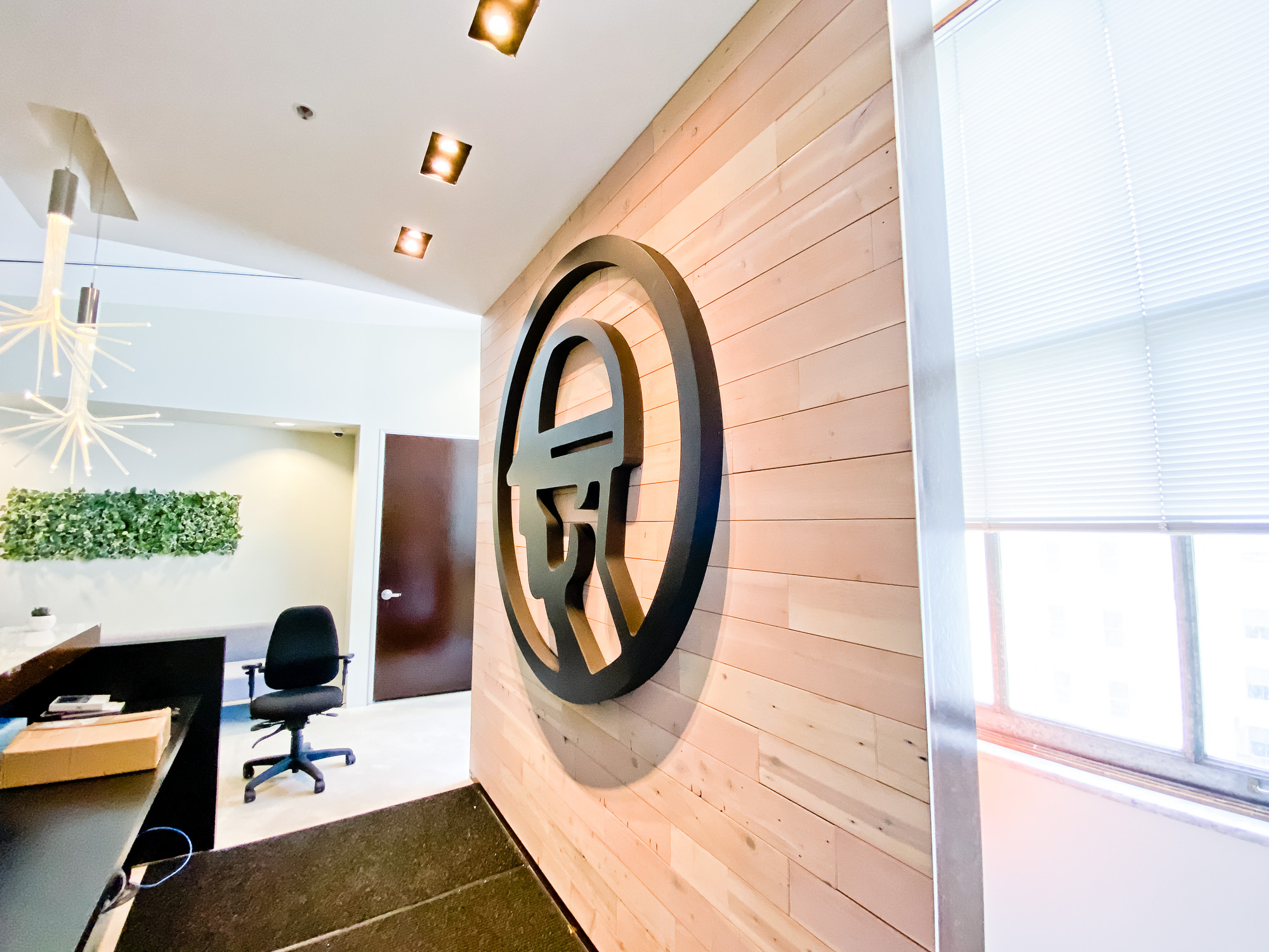 Dimensional black reception wall and desk sign for the San Francisco lobby of Fieldwire, a company creating a construction field management platform designed for the jobsite. Dimensional black reception wall and desk sign for the San Francisco lobby of Fieldwire, a company creating a construction field management platform designed for the jobsite.