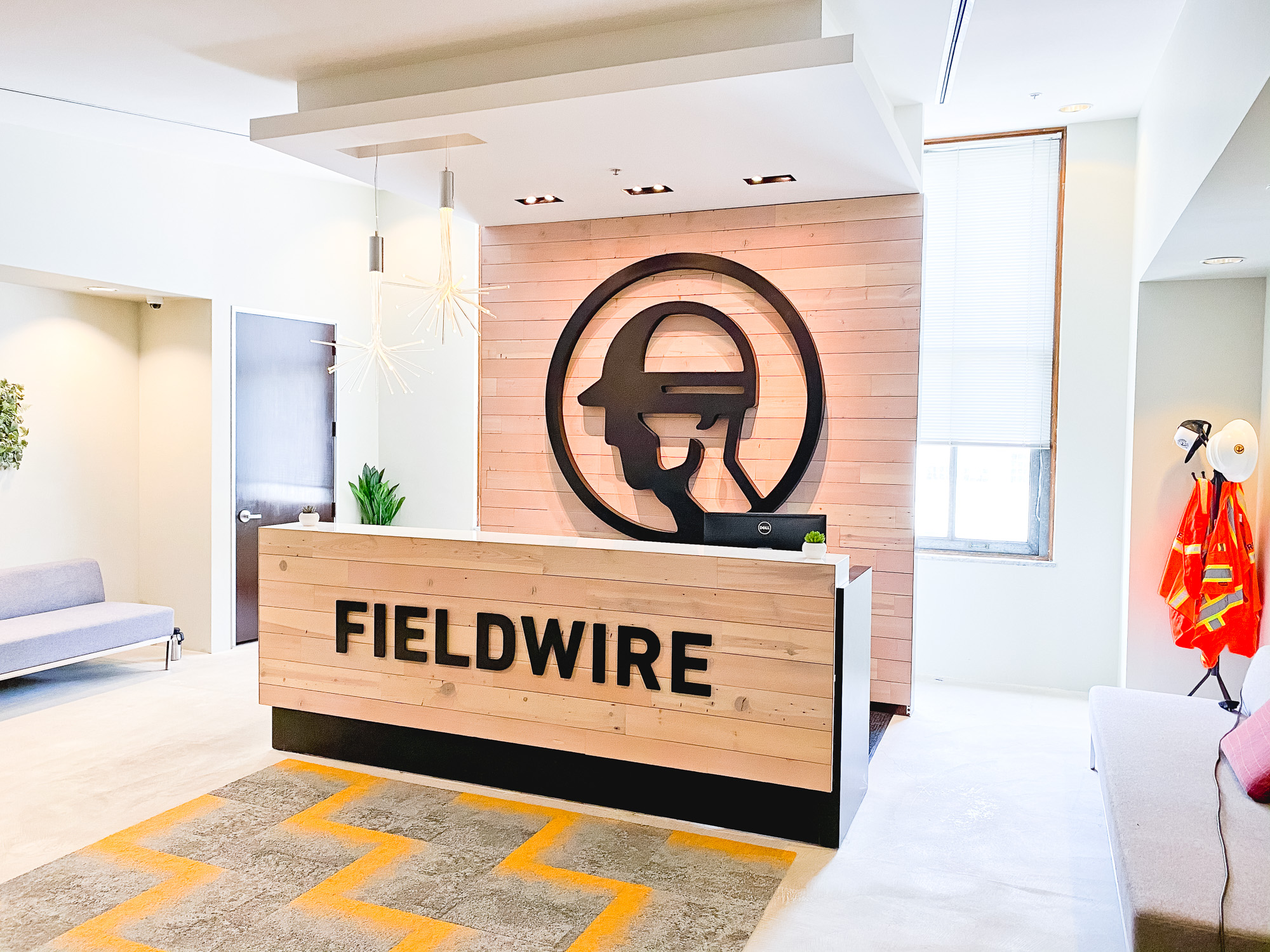Dimensional black reception wall and desk sign for the San Francisco lobby of Fieldwire, a company creating a construction field management platform designed for the jobsite. Dimensional black reception wall and desk sign for the San Francisco lobby of Fieldwire, a company creating a construction field management platform designed for the jobsite.