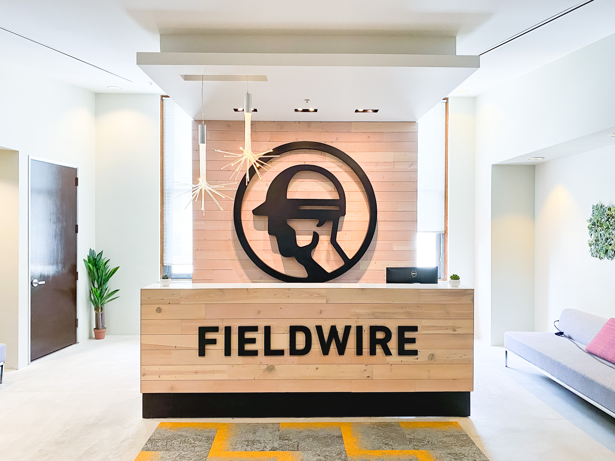 Dimensional black reception wall and desk sign for the San Francisco lobby of Fieldwire, a company creating a construction field management platform designed for the jobsite. Dimensional black reception wall and desk sign for the San Francisco lobby of Fieldwire, a company creating a construction field management platform designed for the jobsite.