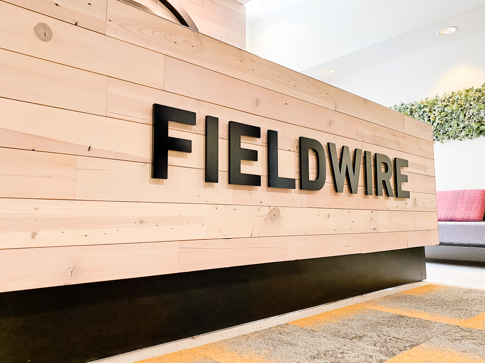Dimensional black reception wall and desk sign for the San Francisco lobby of Fieldwire, a company creating a construction field management platform designed for the jobsite. Dimensional black reception wall and desk sign for the San Francisco lobby of Fieldwire, a company creating a construction field management platform designed for the jobsite.
