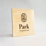 Laser etched/engraved square plywood sign for Park Acupuncture, an acupuncture clinic in Westwood, NJ.