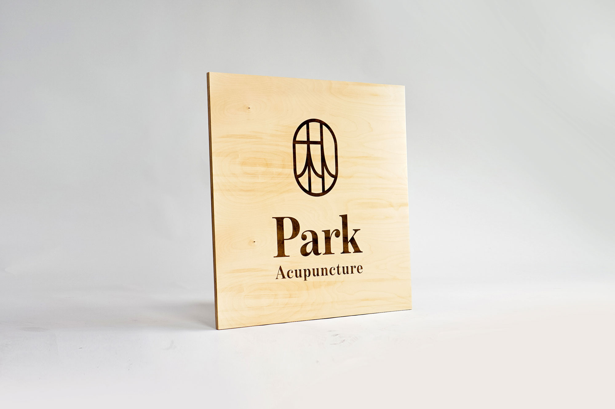 Laser etched/engraved square plywood sign for Park Acupuncture, an acupuncture clinic in Westwood, NJ.