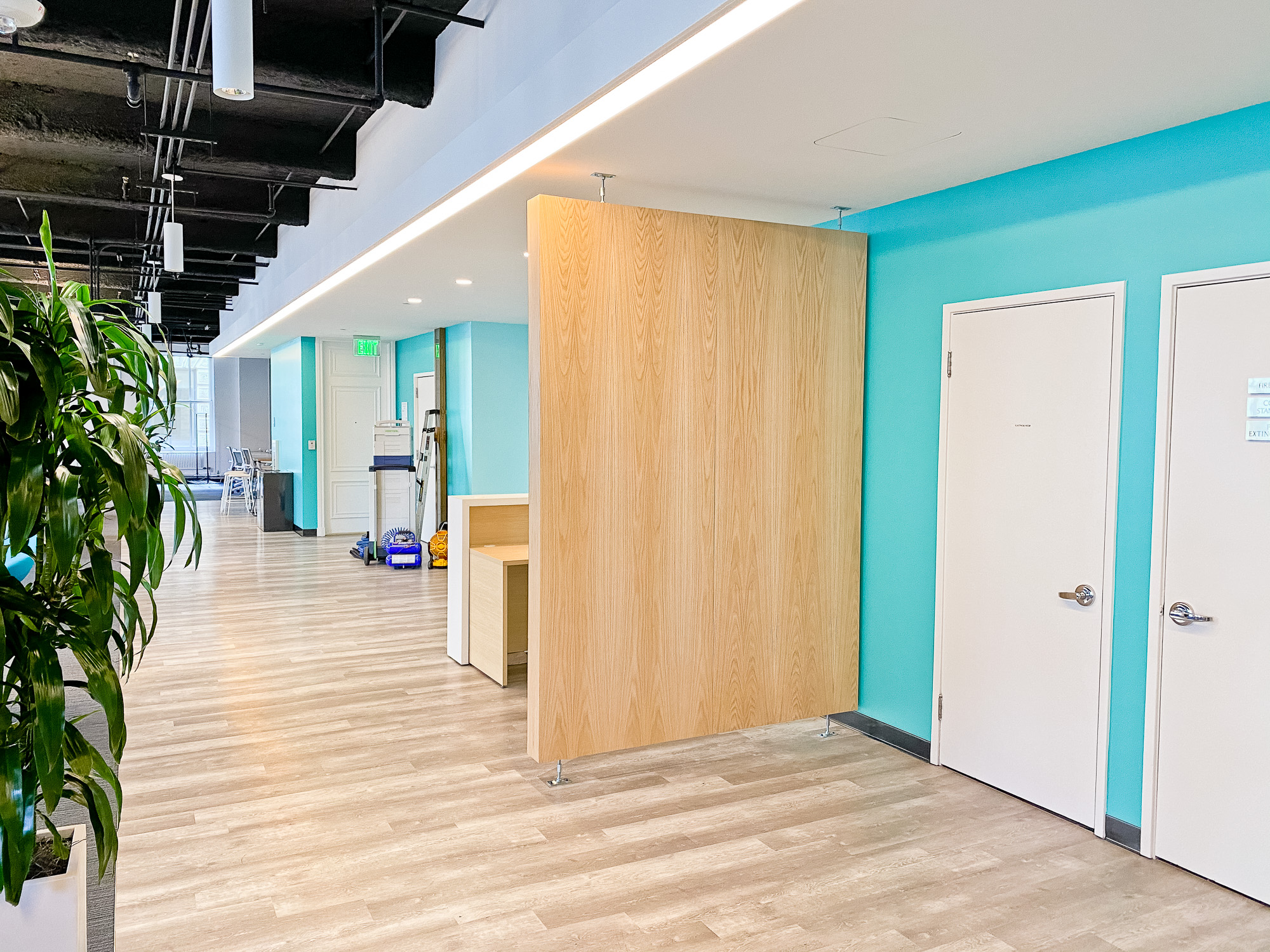 White logo on light wood add-on divider wall for the San Francisco office of Meltwater, a software as a service company that develops and markets media monitoring and business intelligence software. White logo on light wood add-on divider wall for the San Francisco office of Meltwater, a software as a service company that develops and markets media monitoring and business intelligence software.